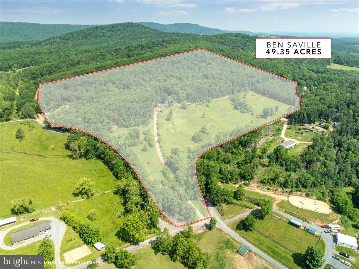 "Peaceful On Ben Saville" This 3 bed, 3 full bathroom ranch style home sits on 49.35 acres! When you step out the front door, you'll be welcomed with breathtaking mountain views! Spacious kitchen with eating area, cozy living room and an additional large room great for a dining room or space to entertain guests. Primary bedroom with private bathroom. All 3 bedrooms on the main level along with two of the full baths. Home has a second kitchen (Commerical Style). Basement has two bonus rooms (One with carpet and the other has a concrete floor). Additional full bathroom in the basement. Property has a 4-stall horse barn and one shed next to it. Two spring-fed ponds on the property. Whether you're looking to start a farm, have hunting land or just enjoy the peace and quiet this property has so much potential! Bring your ideas and come put your own touches to renovate this home! Home is "Sold as is where is". Deck is being repaired (New floorboards and rails).