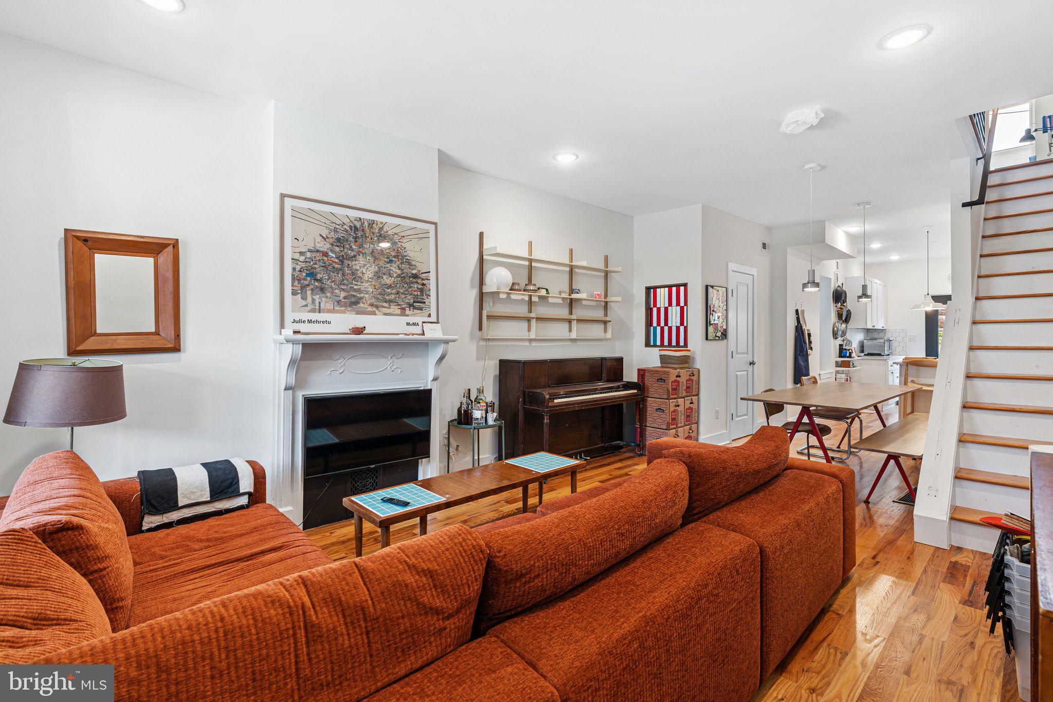 This newly renovated 3-bedroom, 1 full and 2 half bathroom West Philly home is full of thoughtful upgrades and timeless charm. Located just one block from Malcolm X Park and close to Baltimore Ave’s popular cafes and eateries, the home features great natural light, custom stained glass accents, antique French doors in the primary bedroom, and exposed brick details throughout. The kitchen is outfitted with quartz countertops, a high-end Bertazzoni range, soft-close drawers, and stainless steel appliances, with an adjacent powder room and access to a private patio. Upstairs, you’ll find three bedrooms and a full bath with a tub, while the finished basement adds extra living space and another half bath. Modern comforts include a Bosch washer and dryer, energy-efficient heat pump and AC system, new storm door, ceiling fans, and updated light fixtures. Outside, enjoy a producing garden with watermelons, peppers, and herbs, plus an outdoor bike shelter. A high-quality couch and custom dining table with bench, selected to perfectly suit the space, are also available for purchase with the home. Easy street parking and just minutes from UPenn, Drexel, and major hospitals—this home offers convenience, character, and comfort all in one.