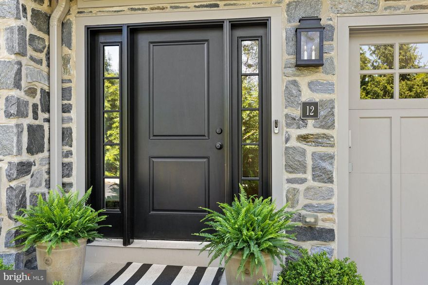 We are proudly presenting this exceptional property adjacent to the serene Morris Arboretum in Erdenheim. 12 Overlea Way is a spectacular townhome in a private, gated enclave of 13 custom homes, offering a luxurious and low-maintenance lifestyle. Built in 2018 and designed by Blake Development, one of Philadelphia’s premier custom builders, this expertly crafted residence spans 3,500 square feet over four levels and is situated on meticulously landscaped grounds. The home blends elegance and convenience and offers both luxury and functionality in a prime location. You can expect a spacious layout, including 4 bedrooms, 3 full and 2 half baths, and a versatile family room/library. The gourmet kitchen is equipped with custom cabinetry, Wolf/SubZero appliances, Miele dishwasher, and Hansgrohe Axor/Starck faucets. Elegant living spaces combine comfort and sophistication, offering the ideal setting for both everyday living and entertaining. On the main floor, the formal living room exudes warmth and charm, anchored by a cozy Mendota gas fireplace. The living room transitions effortlessly into a distinguished dining room, creating a graceful setting ideal for entertaining. A covered balcony extends the living space outdoors, offering a stylish setting for entertaining or a relaxing retreat for your morning coffee. The ground floor features a family room/library with access to a flagstone terrace, beautifully enclosed by a custom-designed gate. The third and fourth levels offer a private sanctuary, featuring a primary suite complete with a spa-inspired bathroom including radiant heat flooring, as well as a spacious walk-in closet outfitted with a custom-designed organization system for maximum efficiency. Three additional sun-filled bedrooms, two well-appointed full bathrooms, and a conveniently located laundry area complete the upper floors. Charming details define the fourth floor bedrooms with cozy window-seat cushions and custom designed shades. Throughout the home, you’ll find ample storage, including thoughtfully designed closets and additional space within the attached two-car garage which features GarageTek flooring. For added convenience and accessibility, an elevator services all four levels, blending comfort and function. The home’s remarkable features include: a Tesla wall connector EV charger; custom motorized blinds (Thibaut and Shade Store) in select rooms; water softening system throughout home; custom wool stair runner on all stairs, Kohler and Kallista bath hardware; Visual Comfort lighting; a tankless water heater and more! Great schools and a strong sense of community make this area extra appealing. You’re just minutes from Erdenheim Farm, Chestnut Hill shops and restaurants, beautiful parks and an easy commute into Philly and the Main Line. If you are looking for a sophisticated living experience with a low maintenance lifestyle, 12 Overlea Way is for you!