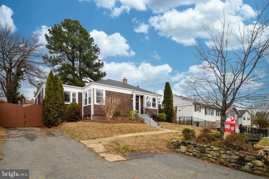 PRICE IMPROVEMENT on this COMPLETELY renovated home comes with a REDUCED FLOATING INTEREST RATE with List & Lock™.  The seller paid program reduces the interest rate for you to qualify for the lower rate and enjoy a  lower monthly payment Terms apply, call your Realtor or me for details and more information. BEAUTIFULLY renovated 1940s bungalow in a prime Annapolis location! This charming home boasts freshly refinished hardwood floors throughout the main level, creating an inviting and spacious feel. The oversized living and dining area features built-ins, while the brand-new kitchen shines with sleek white cabinetry, stainless steel appliances, and quartz countertops.

The king-sized primary suite includes extra space for a cozy sitting area and a brand-new private en-suite bath. Two additional bedrooms share a second fully renovated bathroom conveniently located off the back hallway. Fresh paint, trim, and beautifully refinished floors add to the home's move-in-ready appeal.

Downstairs, the versatile wide open basement has been refreshed in 2024—ideal for recreation, a game room, or extra storage. Additional upgrades include a newly insulated attic and a 2024 roof; windows and HVAC in 2012 and more.  A long list of improvements is available!

Step outside to find freshly landscaped front gardens ready for your personal touch this spring. The spacious fenced (2016) backyard features a stone patio (2015), perfect for cookouts, with ample room for activities like volleyball. A private driveway offers parking for 3+ cars, plus a wide gate allows for additional parking inside the fence.  Ask for the complete list of many updates!
This must-see home combines modern updates with timeless charm—schedule your showing today!