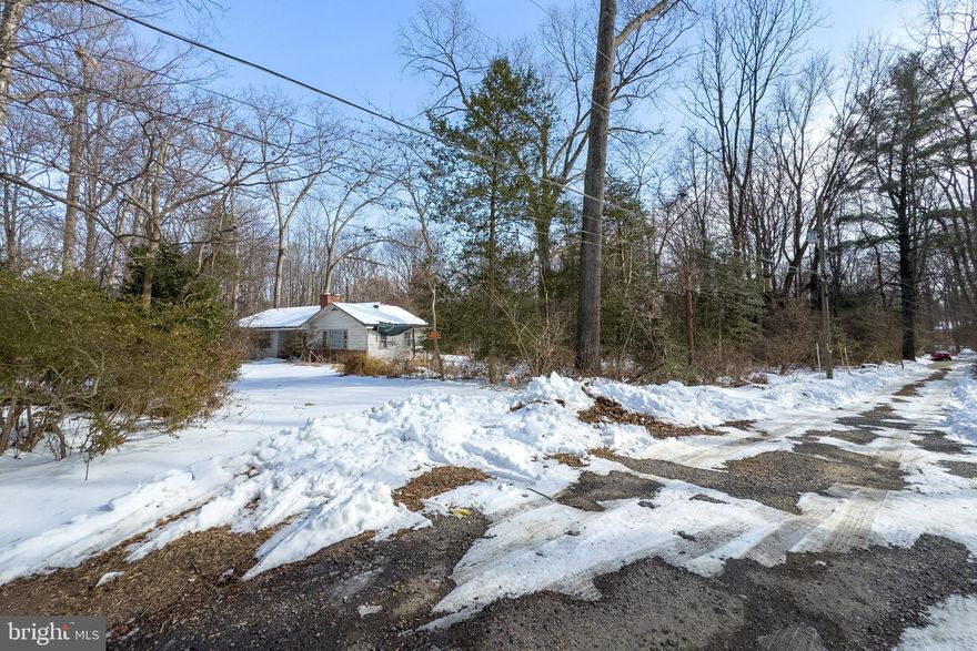 Rare opportunity to secure 6.58 acres in a highly sought-after Fairfax location along Popes Head Rd. The property includes an existing home (likely tear-down)—value is in the land and setting. Electricity is available, and the site is served by an existing well and septic system (buyer to verify condition, capacity, and suitability for intended use).  Whether you’re envisioning a custom estate, private retreat, or long-term investment hold, this is a chance to own meaningful acreage with convenient access to Fairfax, major commuter routes, shopping, dining, and everyday amenities. Sold strictly As-Is/Where-Is. Do not enter the structure. Showings by appointment only—please schedule before walking the property.