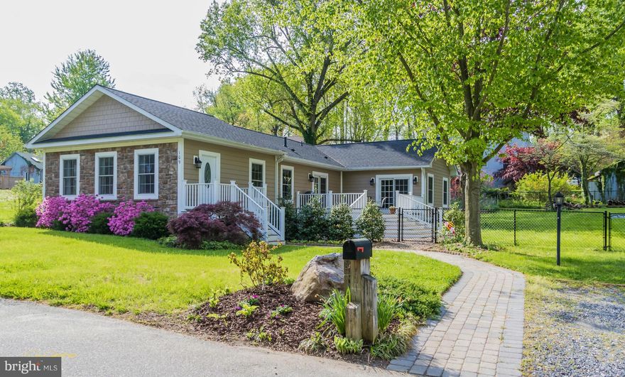 Stunning one level living down the street from the Severn River. Ideal space and layout! Rebuilt in 2009 and still shows like new construction Master suite on main level, great room concept, vaulted ceilings , granite counter tops, stone stacked fireplace hardwood floors, fenced yard, deck, walk to beach and your boat slip on the Severn River! 6 miles to Annapolis!