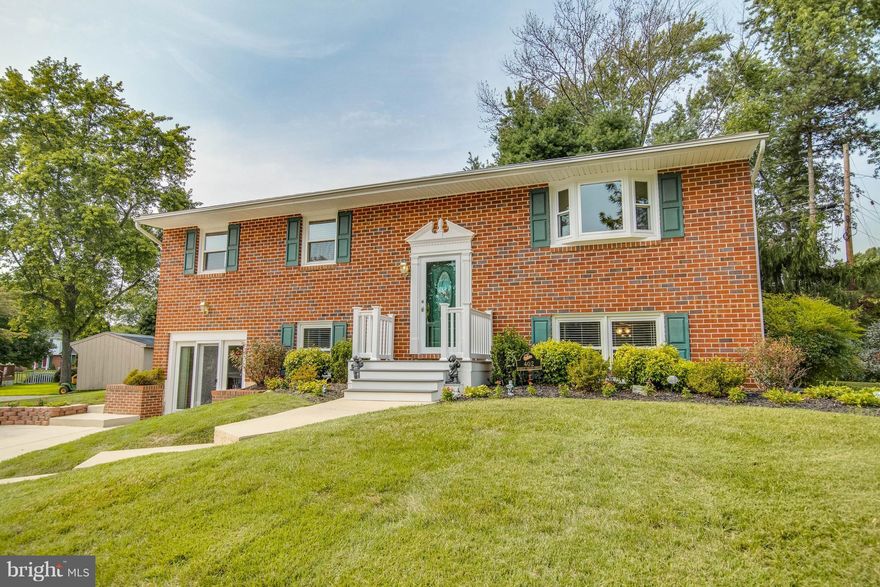 Well Maintained 4 BR, 2.5 BA Home on Manicured Lot. Open LR & DR w/HDWD Flrs & Remodeled KIT w/Quartz Countertops, Island & SS Appliances. Large MSTR BDR w/Sep BA. LL w/Spacious FR w/Brick Hearth, FP, Built-In Bkshelves; Office/4th BR; Excercise/Playrm; 2nd FR (you decide)! Screened In Porch & Patio Overlook Level Backyard! Beautiful Updates Thru-out-KIT, Baths, Windows, HVAC, Roof, Siding & More!