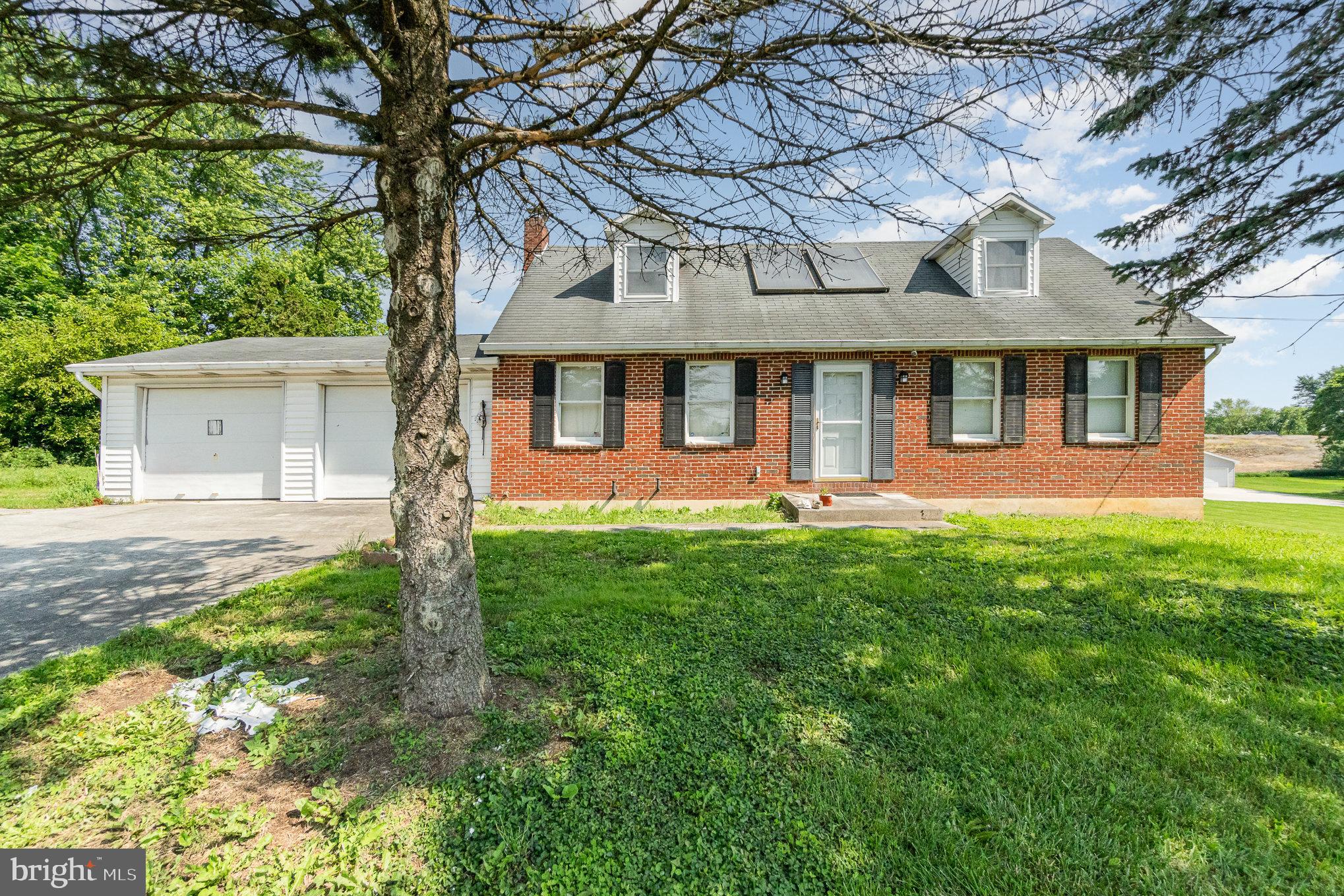 Discover the potential of this unique 29.47-acre farmette featuring a classic brick Cape Cod home nestled in the scenic countryside of Silver Spring Township in Cumberland Valley School District. Offering 3 bedrooms and 2 full baths, this home is full of character and ready for your personal touch. With a bit of TLC, it could be transformed into a stunning private estate. Enjoy additional living space with a walk-out lower level that includes a finished game room, plus a cozy sunroom at the back of the home—perfect for relaxing while taking in peaceful views of your land. A rare bonus: the home is equipped with natural gas heat, uncommon for properties of this size. The property is enrolled in Clean & Green, keeping your real estate taxes low, and is zoned Rural Residential, offering flexible use and plenty of possibilities. A large detached pole barn provides ample space for equipment, storage, or hobby use. Currently, a local farmer rents and farms the land, creating a low-maintenance income opportunity. With its generous acreage, existing infrastructure, and idyllic setting, this property is ideal for someone looking to create a private retreat, hobby farm, or investment property. So much potential—don’t miss this chance to make it your own!