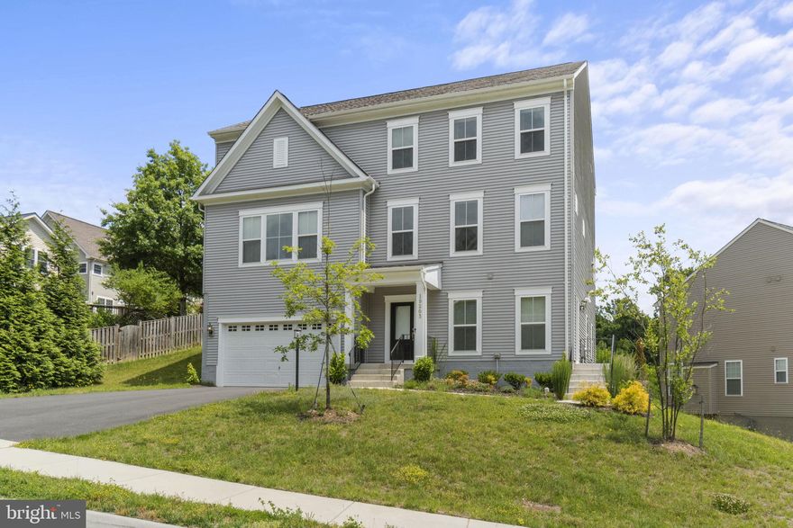 PRICE REDUCED $35,000!!! Why wait for a new build--this beautiful home is only 2 1/2 years old and loaded with options. The main level is very bright and open and has upgraded luxury vinyl plank flooring throughout. The expansive kitchen includes upgraded cabinets with quartz countertops and a ceramic backsplash; large island with pendant lighting; and stainless-steel appliances to include a convection microwave oven, gas range, and upgraded fridge. The flow between the dining room, breakfast area, family room, library, and deck are so inviting and comfortable. Upstairs there are three full baths-one full hall bath with double vanities, a full bath off of one of the bedrooms, and the primary bathroom which only the pictures can do justice (large shower with tile floor and seat and double vanities with plenty of countertop space). There are four total bedrooms upstairs making a total of five bedrooms in the home and an upstairs laundry room for convenience. Double doors enter the large primary bedroom that includes a custom installed closet.  A very unique feature is the basement--can truly be used as its own area such as a mother-in-law suite. It comes with an additional private entrance on the right side; a spacious family room; a wet bar that includes a sink, dishwasher, and fridge; a full bathroom; a large bedroom; and washer/dryer.  Quantico Marine Base front gate and interstate 95 are only a 2 1/2-mile drive--so convenient. Please watch the video and take the 3D virtual tour to truly visualize the flow and how unique and beautiful this home is!!!