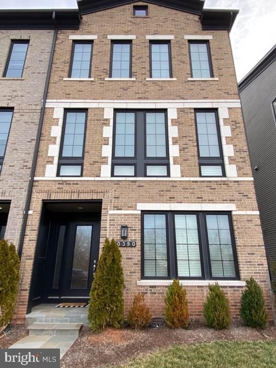 END Townhome, shows like NEW! What a lifestyle! Enjoy all that One Loudoun has to offer. 3 Bedrooms up with 2 full baths. Wait till you see the Great room/Living room. It opens up to a beautiful deck overlooking the courtyard. The Gourmet Kitchen has a huge island, with Gas cooking , stainless appliances and a built in microwave and oven. Engineered Hardwood floors main level, upper hallway & lower level foyer.. Spacious , bright and inviting to all that comes to see this Gem.  There's a 2-car garage, another full bath and a den on the garage/entry level. Amazing thing about this garage ; YES, your truck will fit!