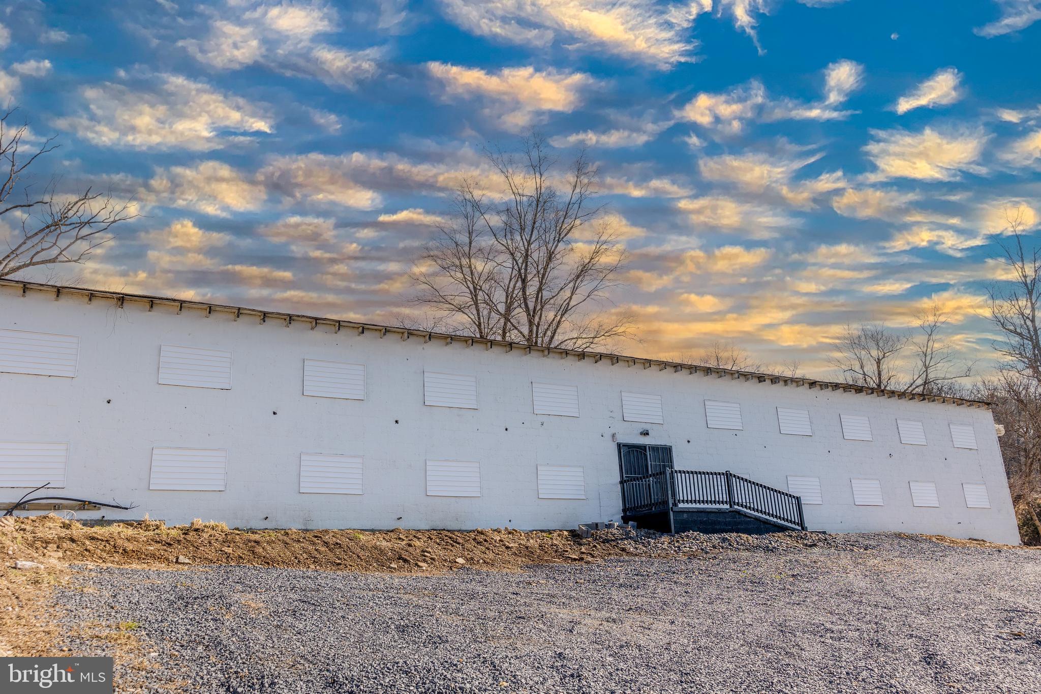Opportunity awaits! This upgraded storage facility features a gated and partially fenced parking area, a security camera system, and room for further development. The storage building encompasses 3,120 total square feet and has all-new (2023) commercial-grade electrical. There are 16 private storage units on the lower level. The upper level comprises open storage. Both levels have ramp accessible entryways. There are two entrances on the lower level.
A detached garage includes 720 square feet of additional storage. Ample parking is available. Shale and gravel have been delivered on site for parking expansion.
A separate driveway leads to the rented mobile home. The 12'x62' home features 2 bedrooms and 1 bath. Long-term tenant in place on a month-to-month lease. Please do not disturb the tenant. No showings of the mobile home. Contact the listing agent for more details. Price based on recent appraisal.