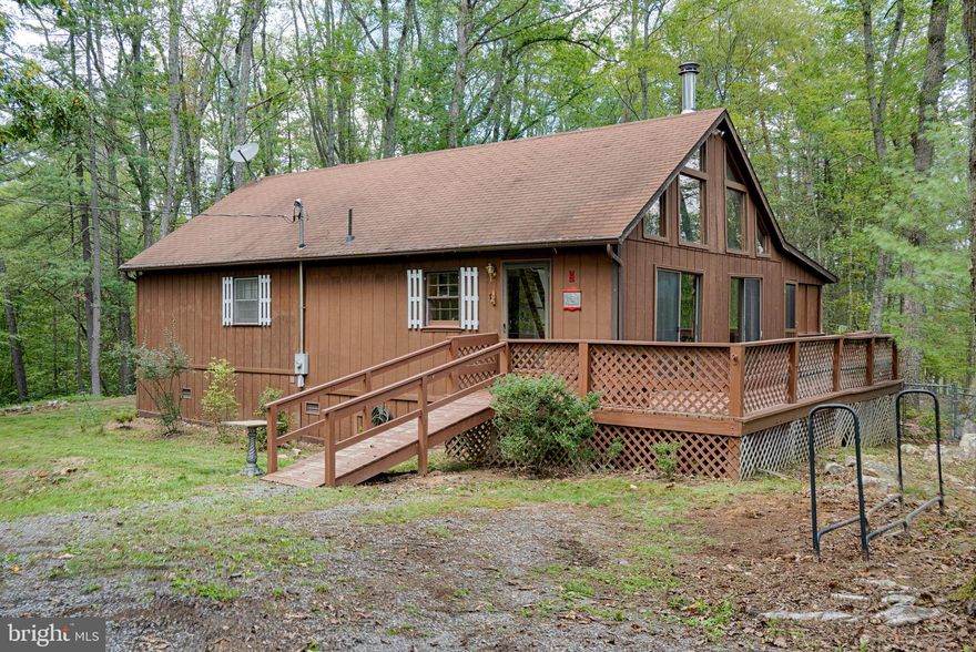 We’re gonna call this one Woodpecker Retreat! Come to the mountains of WV and enjoy the great outdoors. Home sits on a 2.62 acre lot and fronts a county secondary road for great access. This nice 1 bedroom 2 bath cabin is exactly what you have been looking for! This home boast two full bathrooms, and a pleasantly sized master bedroom. It also has another room that would make for a great office space. Open concept kitchen, dining, and living room area with plenty of room for entertaining! Nestled in the small town of Great Cacapon, WV. This cabin would be great for a weekend retreat or a full time residence, best part is the community it is in is short term rental friendly!! Weather you’re a hunter, fisherman, or just a plain outdoorsman this offers something for everyone. This home also has community river access!  Come check it out today and dont let it slip away!