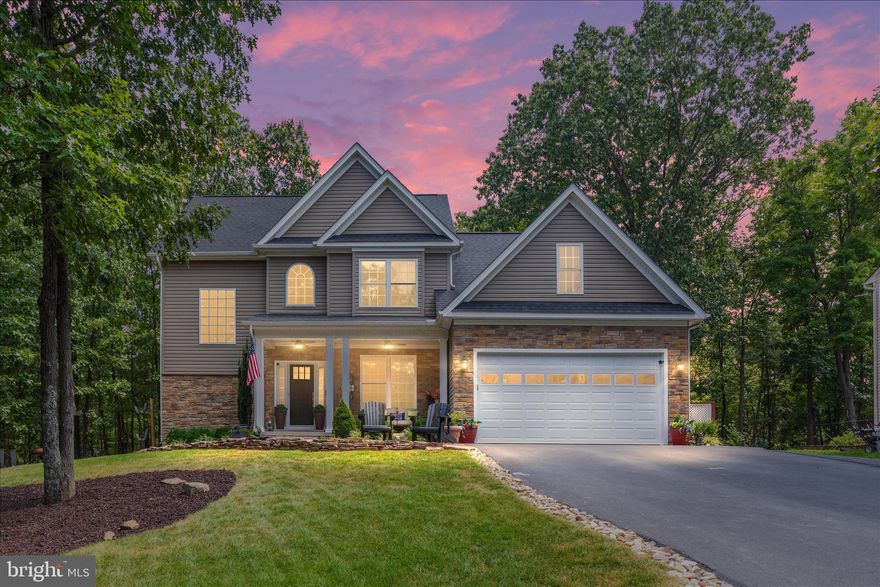 **OPEN HOUSE THIS SATURDAY, MARCH 21 and SUNDAY, MARCH 22 FROM 12-2pm both days!!!** Looking for privacy and peaceful wooded views in Lake Holiday? This beautifully upgraded Keystone Custom Builders home is tucked away on the quiet side of the community and backs to nearly a mile of HOA-owned wooded land, offering a rare blend of privacy, thoughtful upgrades, and lake-community living.
The bright, inviting layout is designed for both everyday living and entertaining, featuring hardwood flooring, tray ceilings, granite countertops, stainless steel appliances, and a dramatic two-story living room filled with natural light and a beautiful fireplace.
A flexible main-level bedroom or office with access to a full bath provides ideal space for guests, remote work, or multigenerational living. Upstairs, the spacious primary suite offers a custom closet and a remodeled primary bathroom shower completed in 2025 with a lifetime warranty.
The finished lower level adds exceptional versatility with a large recreation area, two wine refrigerators, a full bath, and a flexible room that can serve as a fifth bedroom, guest suite, or hobby space.
Recent updates include brand-new carpet in the bedrooms (2026), a remodeled primary bathroom shower (2025), new kitchen sink and faucet (2025), dishwasher (2024), updated stair balusters with modern iron spindles, and new black hardware on interior doors. Custom drapes throughout the home convey.
Additional features include a dual-zone HVAC system serving the upper level and the main and lower levels, expanded parking in front of the home and alongside the garage, and a kayak rack that conveys, perfect for enjoying the lake lifestyle.
Outdoor living is just as inviting, with a spacious back deck overlooking the peaceful wooded setting and a beautiful stone patio below, creating the perfect space for relaxing, entertaining, or enjoying the natural surroundings.
Located in Lake Holiday Estates, a private gated lake community just minutes from Winchester, residents enjoy a 240-acre lake, sandy beaches, marina, clubhouse, walking trails, sports courts, and year-round community events.
If you’ve been dreaming of lake living with privacy, space, and thoughtful upgrades, this Lake Holiday home is ready to welcome you home.