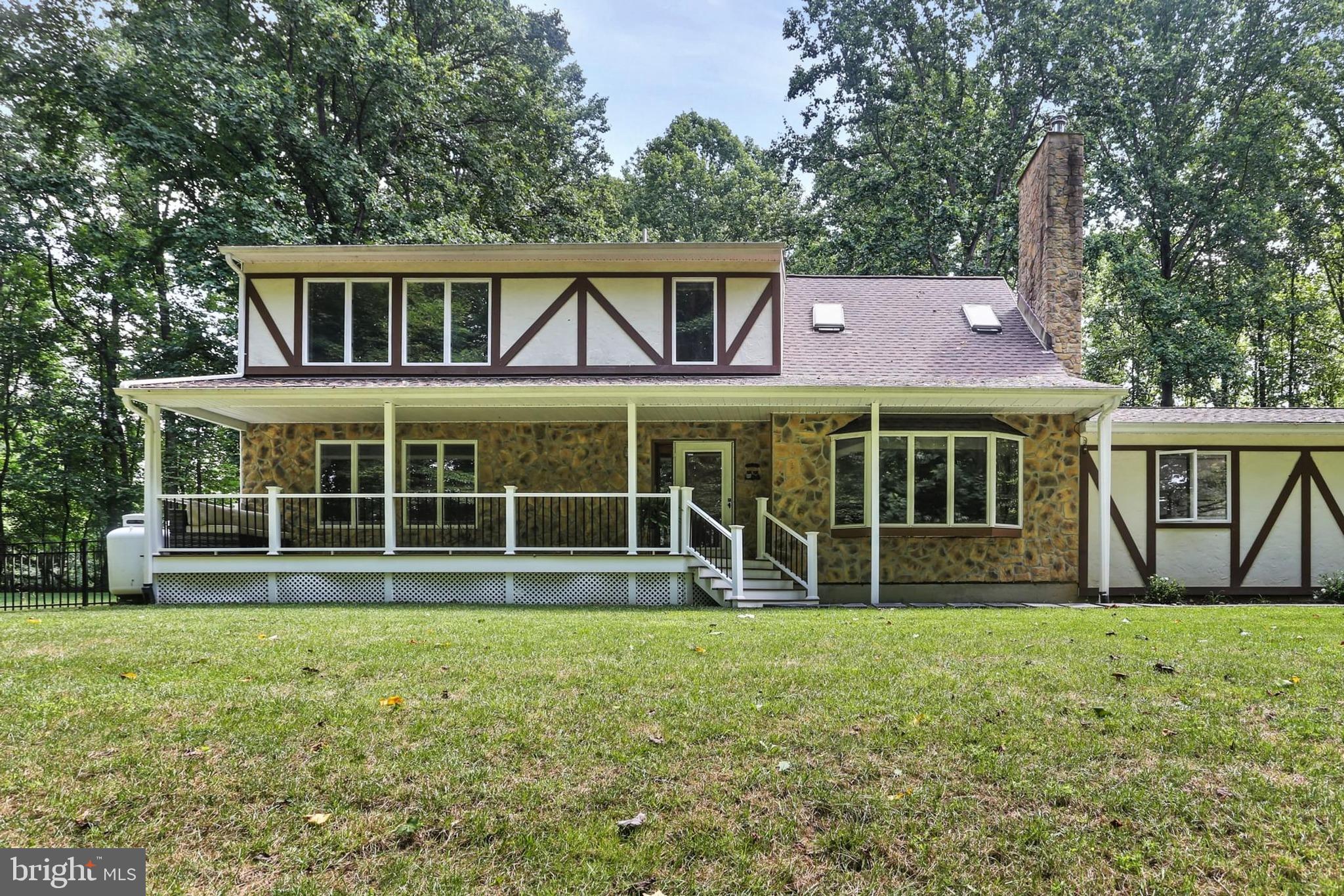 Welcome to this beautifully updated 5-acre retreat nestled in the heart of Upper Marlboro. This spacious home features Brazilian cherry hardwood floors on both the main and upper levels, granite countertops, and a stylish loft overlooking the family room. Enjoy a freshly painted interior, a Moen touchless kitchen faucet, and modern wall-mounted toilets that provide an additional 10 inches of space. The finished walkout basement is ideal for entertaining, enhanced by a 7.1 in-wall sound system in both the family room and basement TV area. The property includes a 24x24 two-car garage with attic storage, a 12x24 metal shed, and a fenced backyard. Solar-powered with a wired attic vent fan and rain-sensing Velux auto-opening skylights, this home also includes a whole house water softener, upgraded water pump for higher pressure, a paved driveway, and is FIOS ready. Recent updates include new siding, a new roof and gutters with leaf guards, and a new hot water heater (2024). All three bathrooms were remodeled in 2025, and the septic tank was just cleaned in May 2024. Additional highlights include a new HVAC system, Bosch dishwasher, LG refrigerator, and smoke alarms. The Samsung stackable washer/dryer adds to the home’s convenience. There’s a new Fiberon front porch and a stunning three-level Fiberon back deck with a roofed center section and lighting on all levels. A stone patio next to the deck includes built-in lighting, and four LED backyard spotlights illuminate the entire yard. The basement includes a sump pump, and there’s a Level 2 EV charger outlet in the garage. The home is equipped with a Generac whole-house automatic backup generator (installed in 2016), powered by two 100-gallon propane tanks, providing seamless backup power during outages. Professionally cleaned ducts and thoughtful maintenance throughout make this property a true turnkey gem offering both peace and performance. This home, owned by its original owners, has been thoughtfully cared for and upgraded.
