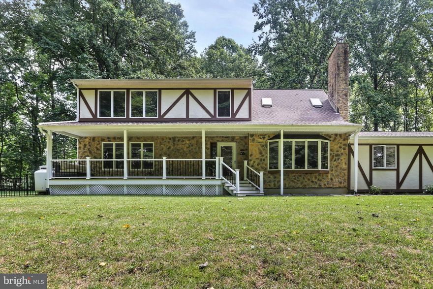 This extensively upgraded home sits on 5 serene acres and has been meticulously maintained by its original owners for perfect ease of living for its new owners! Recent major updates include new siding, roof, gutters with leaf guards, and a hot water heater (2024), along with fully remodeled bathrooms (2025), a new HVAC system, and updated appliances like a Bosch dishwasher, LG refrigerator, and Samsung washer/dryer. Interior features include Brazilian cherry hardwood floors, granite countertops, a Moen touchless faucet, modern wall-mounted toilets, and a freshly painted interior. The finished walkout basement boasts a 7.1 in-wall sound system, perfect for entertaining. Outdoor upgrades include a new Fiberon front porch, a three-level Fiberon back deck with lighting, a stone patio, and LED yard lighting. Additional highlights: Generac whole-house generator, Level 2 EV charger, solar power, Velux rain-sensing skylights, whole-house water softener, new water pump, and professionally cleaned ducts. The septic tank was cleaned in May 2024. With a two-car garage, metal shed, and paved driveway, this move-in-ready home blends comfort, efficiency, and privacy in a truly turnkey package.