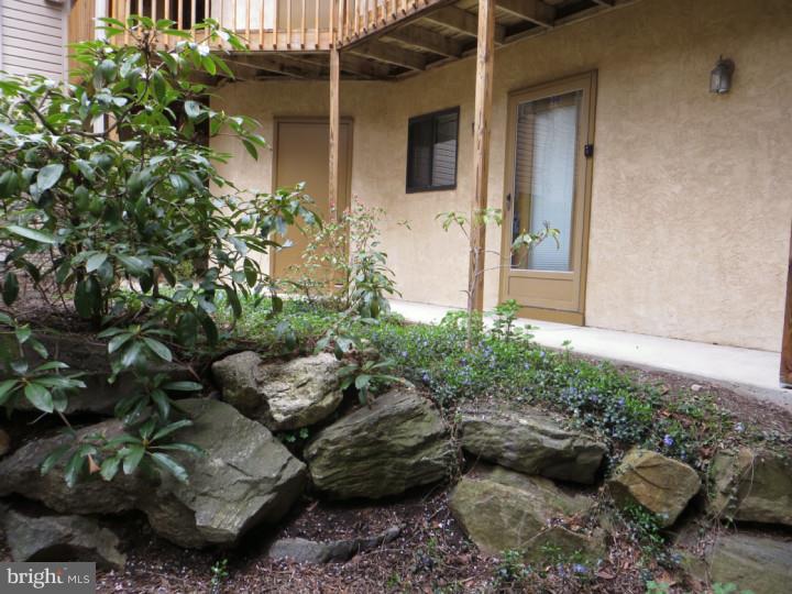 Bring offers! This first floor unit home, features a large master bedroom with a full bath, separate dressing area, with additional his and her closets. A second bedroom and a second full bath, laundry room, living room, and family room make this a warm inviting home. The living room has sliding glass doors that open onto a large patio with a peaceful view. The carpeting has been replaced throughout the entire home, and the home has been freshly painted in neutral colors. Easy access to shopping, Ridley Creek State Park, and Route 3. Call to see today.