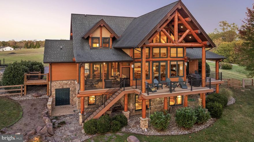 THIS HOME HAS AN OFFER DEADLINE OF 5:00PM on 10/31. Relish in the unhurried moments of waterfront living at Lake Anna, Virginia. The possibilities are limitless at this luxury waterfront home, featuring 238 feet of prime shoreline, deep water, and a level of craftsmanship and lifestyle that is simply unmatched. This retreat is located in one of the most desirable subdivisions on the public side of the lake: Sunrise Bay at Lake Anna. Whether you're looking for the perfect weekend escape, a relaxing primary residence, or a powerful investment asset, this property will meet everyone's needs. Furniture and furnishings convey, and the property is equipped with high-speed internet by Xfinity Comcast. With almost 5,000 square feet spread over three levels, this exquisitely-maintained Post and Beam, log home offers ample space for entertaining, relaxing, and enjoying stunning water views. Unplug in your great room, with its soaring post and beam cathedral ceilings, floor to ceiling stone gas fireplace and large windows showcasing views of Lake Anna that immediately set the mood. The kitchen features granite countertops, two ovens, an electric stove top, two pantries and an island with barstools making it perfect for entertaining. The main level primary suite offers a tile shower, walk-in closet, and sliding doors to the covered deck that overlooks the water. Upstairs, your guests will enjoy three private bedroom suites , each with their own bathroom. The walkout lower level adds even more flexibility, with three additional bedrooms (one en suite and two sharing a Jack-and-Jill bathroom), plus a spacious family and recreation room, ideal for gatherings and extended stays. The deck with a BBQ grill and patio furniture is the perfect place to unwind at the end of the day and take-in the water views. There is also a screened porch to enjoy the breeze! Follow the professionally designed hardscaping to the massive two-slip boathouse, featuring two electric lifts, a sun deck, a shaded picnic area, and a storage room. A double jet ski pad also conveys.  Take an afternoon nap in the hammock and end your day around the fire pit roasting s’mores and making memories. Additional features include a paved driveway, exterior lighting, meticulous landscaping, and a fenced backyard, all set on a premium 1.75 acre lot. This home is currently a successful short-term rental with a strong rental history. Ideally located just minutes from The Cove Restaurant, Tim’s at Lake Anna, groceries, local dining, ABC, nail salon, vet clinic, Lake Anna Taphouse, coffee shops, and more, this exceptional property combines luxury, lifestyle, and investment potential in one extraordinary package. Experience the art and magic of waterfront living at its finest!