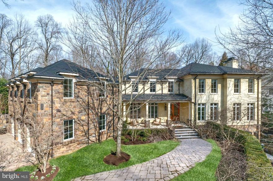 Rare to the market! This one-of-a-kind extraordinary home with quintessential European style and modern elegance nestled on a quiet cul-de-sac in Langley Forest. Unparalleled custom finishes and details throughout. Marble floors, stone fireplaces, oversized windows allowing the home to be flooded with sunlight! Every room has something special. A two-story Foyer with an elegant curved staircase opens to the formal Living and Dining Room. The Kitchen features custom cabinets and top-of-the-line appliances and a Breakfast Room that is surrounded by windows. A relaxing retreat awaits in the Owner's Suite that has a Breakfast Bar, luxurious Bath with separate vanities and custom Dressing Room with walk-in Closet. Walkout lower level features the Theater, Wet Bar, Fitness Room with an incredible spa Bath with steam shower. A separate Guest / Au Pair suite is complete with a Kitchen, Living and Dining area that has doors opening to the terrace that overlooks the pool. The private backyard is an oasis with stunning gardens, flat yard to play, pool and spa, expansive stone patios are perfect for al-fresco dining and entertaining.