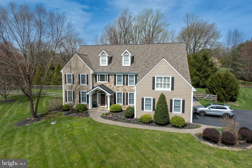Discover an unparalleled fusion of classic Chester County grace and breathtaking contemporary design. With over $260,000 in bespoke renovations, this estate has been meticulously curated for the discerning homeowner. Situated on nearly two private acres at the end of a serene cul-de-sac, the property offers a sanctuary of tranquility and leisure, yet remains moments from the vibrant town centers of Kennett Square and West Chester.
A grand two-story foyer welcomes you, unfolding into a brilliantly reimagined floor plan. The main level is an entertainer's dream, from the formal dining room to the private study with elegant French doors. At the home's heart, the expanded great room is anchored by a commanding stone fireplace and a versatile sitting area with beautiful decorative built-in bookshelves, perfect for a library or play area.
The kitchen is a triumph of culinary design, featuring bespoke inlay cabinetry, a magnificent black walnut island, and a seamless porcelain slab backsplash with matching floating shelves. The appliance suite is second to none, with a Miele dishwasher, an 8-burner gas cooktop, and a 48” Sub Zero refrigerator. There is also a wonderful beverage center also with floating shelves. The kitchen is a true show-stopper! In addition, there is a wonderful laundry room/mudroom adjacent to the kitchen which is super convenient for coming and going from the out of doors (especially for dogs) into the fenced in area with patio and deck! There are several access points to the outside which is convenient and lends itself well to indoor outdoor entertaining! 
Ascend to the owner's suite—a true private retreat. It boasts a spacious sitting room, dual walk-in closets, and a spa-like modern bath. Here, a vaulted ceiling, floor-to-ceiling porcelain tile, and an oversized dual vanity create an atmosphere of pure and tasteful luxury. There are 4 other large bedrooms with custom blinds and ample closet space as well as 2 additional full bathrooms on this floor making the morning and evening routine a breeze!
The lower level offers boundless entertainment possibilities, highlighted by a newer beautiful temperature-controlled wine cellar with cork flooring. There are two recreational areas - one with a billiard table, the other for lounging comfortably with lots of space for family and friends.  There is also a full bathroom on this level for guests.  French doors open to a secluded, fenced-in backyard where a beautiful stone fireplace and paver patio await, offering the perfect backdrop for memorable evenings. There is also an charming shed tucked away on the property and adjacent to a batting cage for the baseball enthusiast!
An offering of this caliber, in a wonderful location, where every detail has been perfected, is a rare opportunity.