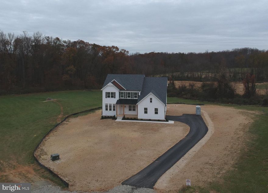 MOVE IN READY!!Beautiful Farmhouse Feel and Design. Beautiful 3.25 Acre Lot with Panoramic Views!  This Kingston Farmhouse Model offers 4 Bedrooms and 4-1/2 Baths, 2 Foot Rear Bump adding 244 sq. ft., 9 Foot Ceilings, Chef's Dream Gourmet Kitchen, Shaker 42" Cabinetry, Huge Walk-in Pantry, Quartz Countertops, Stainless Appliances, Wet Bar w/ Mini Fridge, Formal Dining Room, Gas Fireplace Upgraded Tile and LVP, Solid Oak Stairs on main level, Finished Basement with Rec Room, Bedroom/Study, Full Bath, Craftsman Rails, Extended Front Porch Horizontal, Board and Batten Siding  Metal Porch Roof , Side Load Garage, Mudroom with Cubbies. Great lot with potential for a future pool, detached garage or pole buildings etc. NO HOA! Welcome Home!