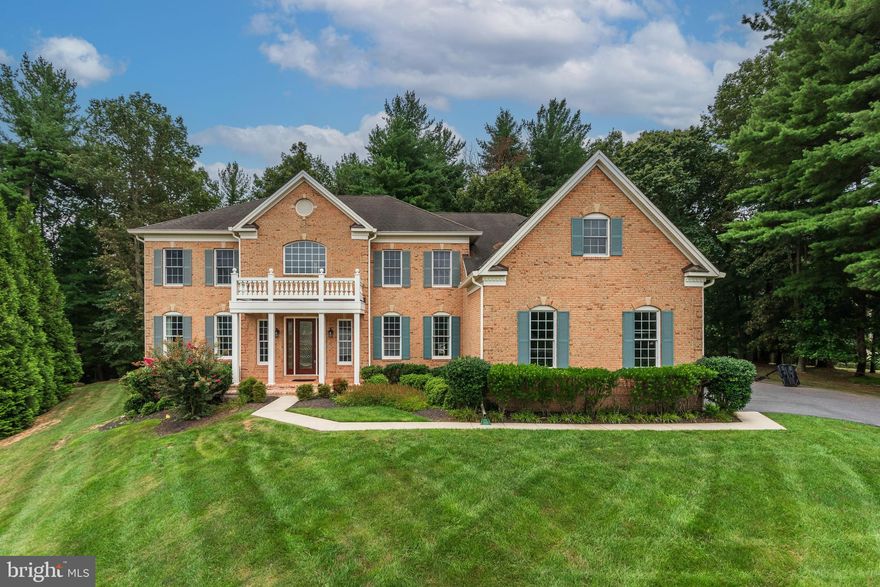 One of Toll Bros. most elegant floorplans sited at the very end of the cul de sac on one of the largest lots in Waterford Farm; backing to trees and wooded open space.  This coveted lot is also elevated to enjoy ultimate privacy in the rear and peaceful scenic views in the front.  Embrace the 2-story foyer as you enter the expansive covered entry through the 8 ft stained glass doorway flanked by stained glass side lights and additional windows. You will immediately be impressed by the dual  curved staircase framed by  columns revealing the 2-story family room graced  by a wall of windows  with captivating views of trees from every view point.. Enjoy  relaxing in front of gas fireplace while watching the seasonal display in the privacy of your home.  The center of this beautiful home is completely open from the main entrance to the rear and framed by custom moldings, tray ceilings, and over-sized windows.  Flanked by the formal living room, dining room, generous office/library and over-sized gourmet kitchen with giant island, central gas cook-top station  and seating; large sink with serving bar over-looking Naples Palladian addition of an octagonal  all season space, along with separate breakfast room offering so many options for additional breakfast/dining/entertaining spaces.  Wood full height cabinetry, granite counters, double oven, new refrigerator, pantry,  large casement windows for additional light, main level laundry/mud room entrance and a  separate room with  rough-in ready for a future second kitchen/butler's pantry.  Exit the kitchen area to relax and enjoy an expansive composite  deck  with  dining area surrounded by private open space.  Access the upper level by the front or rear staircase to enjoy 4 generous bedrooms, each with recently up-dated ensuite baths.  The primary suite  will take your breath away; sitting room, comfortable sleeping space, 2 walk-in closets and primary bath that will delight the most particular needs; 2 separate vanities and 2 separate water/closets, double shower, surrounding the free standing  6ft. soaking tub framed by another wall of windows. The expansive lower level is unfinished with rough-in for full bath, walk-up rear stairway, additional ceiling height to promote ease in future finishing.  3-car side entry garage, 3-zone HVAC , new gutters and hardwood floors throughout the main level.  Minutes to all that Western Howard County has to offer; Western Regional Park and Library, ES, MS and Glenelg HS, Cattail Creek Country Club, shopping and restaurants. Rt 97 offers convenient access to Rt. 70, the ICC and beyond.  Welcome Home to this treasure.