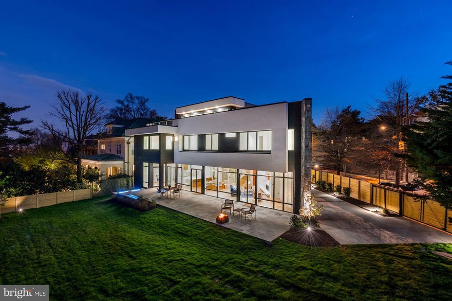 OPEN HOUSE 6/12 2-4.  Stunning new modern construction by INLE Development. Very private and completely hidden from the street by tall hedges, this exciting home has an expansive roof deck, floor-to-ceiling windows and multiple sets of glass doors that open to a large terrace and a lush, extremely private setting of over 11,000 square feet — ideal for entertaining.  A circular drive and large two-car garage can accommodate 6 - 8 cars.   The home has four levels of living space, all served by a glass elevator.  The first level has high ceilings and an open floor plan, plus a private office/den (or bedroom) with full bath and front and back staircases. Four bedrooms, each with its own bath, plus an office or study are on the second level, and a spectacular master suite on the top floor opens out to an extraordinary roof deck with unequalled views of the National Cathedral and the cityscape, including the dome of the U.S. Capitol.  The lowest level has 11’ ceilings and features a wet bar, a wine cellar, a full bath and additional living and entertaining space.  Potential to add a pool.