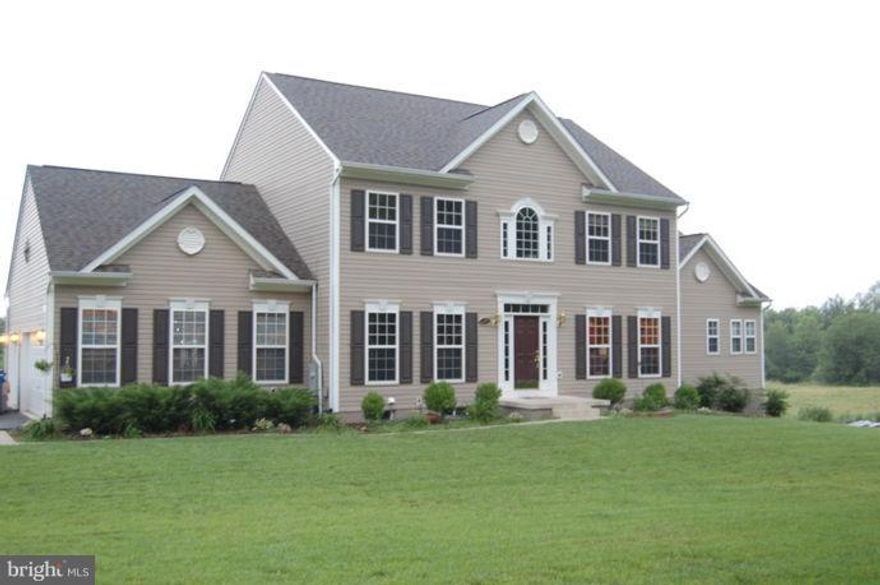 Major price adjustment! Home is below tax assement and appraisal!Owner is ready to sell!  Vacation at Home! Stunning custom built home with many upgrades. Gourmet Kitchen w/sun-room addition. Main level Master suite. 6 bedrooms, includes 2 in-law/Au-pair suites. 2 laundry rooms. 2nd kitchen on lower level. Theater room. In-ground heated pool. 2 decks for entertaining. Hardwood floors through out. Loft area. 30 plus acres mostly wooded. Hot tub. Home Warranty and owner is also paying $1000.00 towards pool and fireplace instructions on how to maintain! Come take a look at this home!