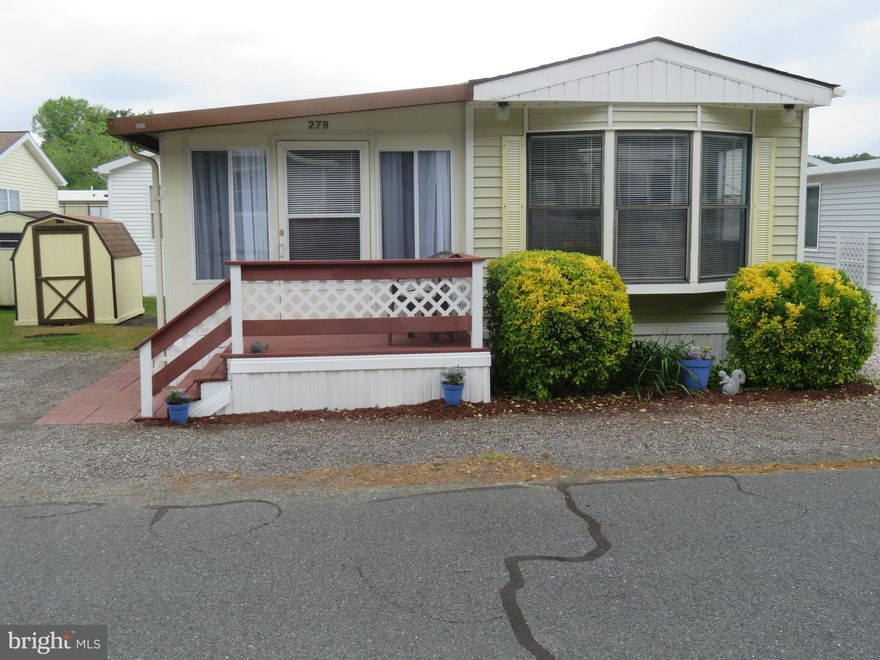 OWN YOUR LAND & HOME GETAWAY/affordable vacation or 2nd home nestled on MD's Eastern Shore . NO GROUND RENT, NON SMOKING HOME & NOT A RENTAL. FIND THIS  HIDDEN GEM IN THIS 24 hr. private security gated ST. MARTIN'S RIVER WATERFRONT COMMUNITY which HAS BEEN KNOWN AS A BEST KEPT SECRET. This is an attractive investment for those seeking a slice of coastal living without breaking the bank. Approx. 10 minute drive to boardwalk & sandy beaches of Ocean City, MD . This 2 bedroom (2nd bedroom has a flexible room size design with a movable curtain divider or you can put up a permanent wall where you choose. There is  1 new renovated full bathroom w/tub/shower along with additional 1/2 bath. This manufactured beach home, fully furnished., Large  kitchen space with lg. bay window providing the perfect spot to enjoy your morning coffee. Polybutylene piping changed to CPVC. Home freshly painted. Park 2 cars off street in gravel driveway.  Lightly traveled quiet street. Just a very short distance down street, see the community large fenced in-ground pool & clubhouse w/pavilion. roof fans and picnic tables. Community has a riverfront marina, piers with boat slips (some slips for daily rentals. Boat slips are $550. for a season). Gazebo by the water to sit, relax & watch sunsets or where you can do some crabbing. There is also an area to clean your fish when coming in from day out on boat. Private boat ramp w/additional overflow parking area. Public water/sewer $52.00. monthly, cable is $207.89 every 6 months. Included in $121.00 monthly home owner assoc. fee, free trash removal, clubhouse, pool, (small  sticker fee now $75.for fenced in storage area where you can store your boat & trailer/jet ski year round if you choose not to have a slip & has an area to clean your boat).  Basketball court, tot playground for kids, canoe/kayak racks, picnic tables and grills, 2 bath houses with laundry rooms, showers and bathrooms to rinse the sand off your feet when returning from the beach.  BEST OF ALL THE PARK CUTS YOUR GRASS. All white appliances and cabinets, heavy duty washer/dryer, water heater, microwave, fridge, pantry, range & hood and a new kitchen countertop adding a fresh & modern touch to this space. Central A/C & heat throughout entire home was installed new around 2006., 2 ceiling fans, cathedral ceiling. Brand new LVP flooring, vinyl bath & bedroom floors,  metal roof on sunroom side of home, architectural  roof  main side of home & shed (approx.12 yrs new).  3 Flat screen TV's. LOTS OF COMMUNITY AMENITIES & residents can enjoy a variety of activities & events organized for lots of family fun (Ice Cream Socials, coffee & donut mornings, bingo, community yard sale open to public, crab feast, bike riding  & many more. Hop, skip & jump to many restaurants, stores & unique shops, farmers market, car wash facilities, golf courses & casino. Walkway just across street from this community leads to  weekly farmers market, craft shows, live bands under a pavilion, large playground. Per FEMA (flood zone x)  a area determined to be outside the 100- and- 500 year floodplains. Seller has paid for survey and has survey approved by White Horse Park management which is required to complete a settlement.  Please note there are some county limited restrictions as to when you can stay in park during winter months. There is off season occupancy use per county code. Full time use April 1-September 30th. 60 days total use from October 1-March 31. If questions ask listing agent or park manager.  Park is open 365 days. Must enter park to view with REALTOR. Office is open 8am to 4pm except closed on Sunday. When office is closed security guard is at gatehouse in front of office to sign in w/REALTOR. Security guards on duty 24 hr. yr round when office is closed. No latent defects known by owners.