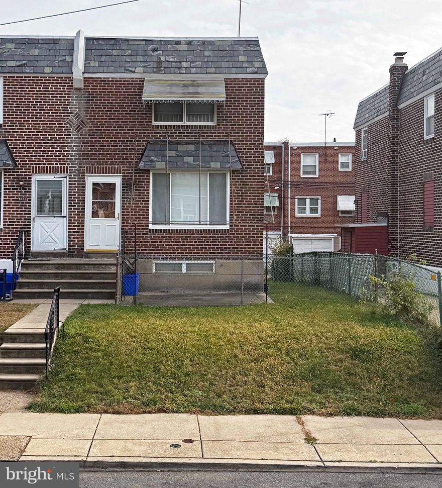 This home in Tacony is an all brick, end of row, airlite style with 3 bedrooms and 1 full bath. It is in need of updating/remodeling throughout. The home has been in the same family since it was built, approximately 1951. It features a front yard, side and rear yards, and a rear garage under the home. It has natural gas for the furnace, oven/range, and hot water heater (2019). The windows are replacement vinyl style, age/date unknown. Hardwood floors are under the downstairs carpets and upstairs - condition unknown.