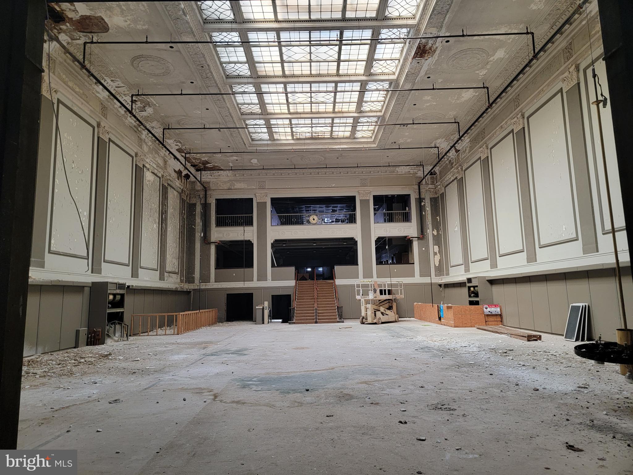 511 - 515 Penn st Reading Pa 40,000 square foot building in the Central Business District of Reading Pa. Former bank with lots of uses. In the Keystone Opportunity Zone. .33 acres 40,000 square feet of retail /commercial space in the heart of Penn St Reading between 5th & 6th Streets in the heart of the Reading Downtown Improvement District. Formerly Reading Trust stretches from Penn St to Court St with access on both streets. This is in the Penn Square Overlay District with underlying Commercial Core (C-C) district. 3 Story building with large 40 Ft Atrium Ceiling. .33-acre property has a full basement with many vaults. Single or Multiple tenant occupancy. Close to Reading Post Office, Attorney Row, City Hall, County Offices, and The Sovereign Center. New Roof. Multiple elevators, sprinkler system, several parking garages within walking distance. Public transportation on 5th St. Perfect Redevelopment project. Many Grant Opportunities paying for rehab and development with the CRIZ Grant Paying up to 80% of property acquisition and rehab for commercial development and other potential programs. Approximately 30 apartments should be possible with the first floor staying commercial.
