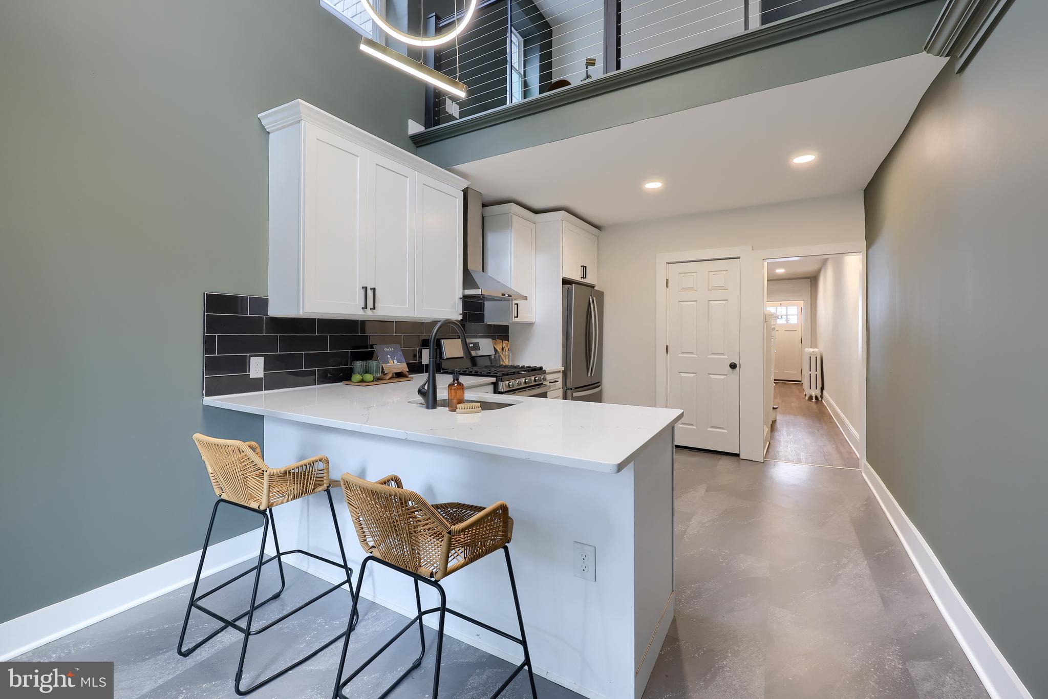 Welcome to 426 Manor Street! This 4 bed 2 bath townhome boasts 1,938 sq ft of remodeled living space and combined historic charm with modern finishes. Walk up to the front porch and into the gorgeous living area. The spacious living room flows into the dining area which is great for entertaining. The new vinyl plank flooring and wainscoted walls draw out the charm of the space. The breakfast area has 20+ foot ceilings and has a sliding door leading to the backyard. The eat-in kitchen has stainless steel appliances, soft-close cabinetry, tiled backsplash and new flooring. Upstairs the master suite is spacious and has recessed lighting. The en-suite bathroom has a tub shower, bathing tub, and double vanity. The office overlooks your kitchen and has a window for natural light. The 2nd full bathroom and hallway laundry are conveniently located. The 3rd floor has two additional bedrooms. The fenced in backyard creates a secluded setting to relax and enjoy the weather. There has been extensive upgrades including upgrading the plumbing, electrical, and a new boiler. Located just blocks from center city and close to shopping and dining including Central Market, Fulton Theatre, and much more! Don't miss your opportunity to see this beautifully remodeled home in the heart of Lancaster City!