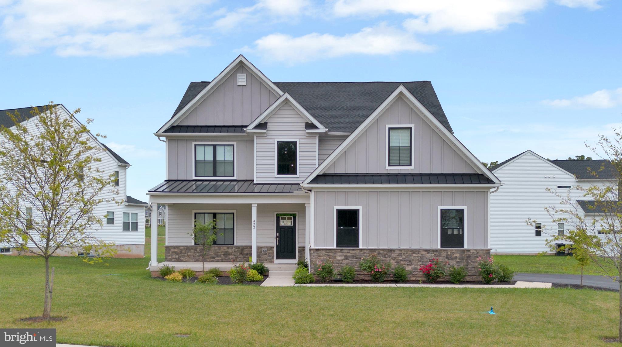Introducing 422 Emerald ct, the beautiful Bradford model Farmhouse! Enter from your front porch and be greeted by a grand double story entry way. Moving inward, an open layout seamlessly connects the family room with cozy fireplace, dining, and gourmet kitchen (complete w/ quartz counters, tile backsplash, and upgraded cabinetry), pantry ,and included sunroom, creating an ideal setting for gatherings. Additionally, on the first level you will find your very own home office, a powder room as well as a spacious mudroom. The upper-level features 3 guest bedrooms, a hall bath, laundry room, and luxurious owner's suite with attached full bath and a sitting area. The owner’s suite offers a tranquil retreat area, perfect for relaxation. On the lower level, a large unfinished basement equipped with walk-up steps is ready for your personal touch—whether it’s a home theatre, gym, additional living space, or storage. Side entry 2-CAR GARAGE with a garage door opener. Enjoy luxurious living with convenient access to top-rated schools, shopping, dining, and recreation.”