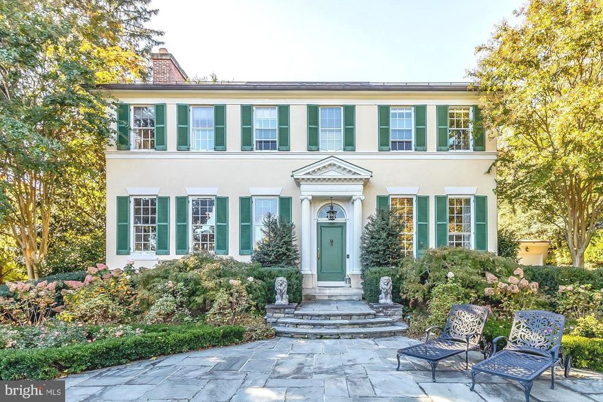 Magnificent 6,700 sq ft living area, 5-bedroom, 3-full- and 2-half-bathroom Federal style stucco home with origins as a stately four-story 1850 Mount Vernon rowhouse that was relocated and rebuilt in 1930, room by room, on 3.7 majestic acres in the heart of Ruxton. This meticulously restored and expanded architectural treasure boasts original mid-1800s details, including custom crown mouldings, seven original fireplace mantles, detailed inlaid wood floors, 11'8" ceilings,  floor-to-ceiling windows, and so much more. Extensive renovations and a 1,000-sq-ft. two-story addition were completed by the current owners after purchasing the home in 2010, as well as the construction in 2022 of a 16'x32' gas-heated inground pool with tanning ledge and Pebble Tec finish. Ideal floorplan for entertaining, including a Foyer entrance with gilded ceiling, formal Dining Room and Living Room with double French doors leading to center hallway. Past the hallway await a cozy yet spacious Family Room and an impressive Office with custom built-ins, followed by the dream Gourmet kitchen with oversized island, custom cabinetry on three walls, pantry, and a full-sized breakfast room with French-style sliding doors leading to the gracious and expansive stone patio, a sublime place to entertain or relax, overlooking the lush gardens and swimming pool. The main floor also has a mudroom, Laundry Room, two half-bathrooms, and walk-in storage closets. The second floor boasts an open and inviting center hallway sitting room, a Primary Suite with walk-in closet and two additional closets as well as ensuite bathroom, four additional bedrooms, a Jack-and-Jill bathroom and a third full bathroom. The unfinished third floor is insulated and ready for your finishes as a sixth bedroom. Energy efficient heating and cooling with four-zoned Geothermal HVAC system. The gated private driveway leads to two separate parking areas for guests on either side of the home, and an oversized attached garage for two vehicles plus additional storage space. A comprehensive list of improvements is available upon request.