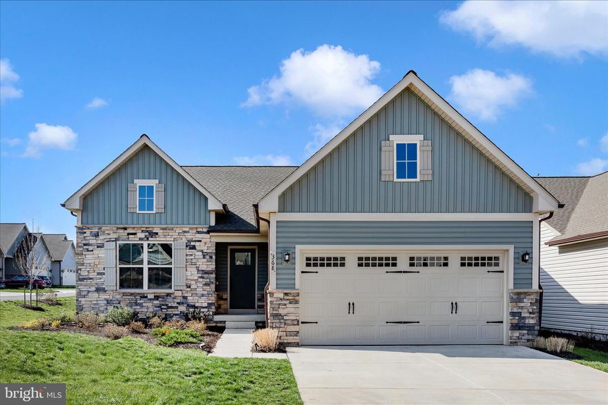 Why wait for new construction when you can move in before summer? This beautifully designed home features an open floor plan with an impressive great room, perfect for entertaining, and a gourmet kitchen with a walk-in pantry. Gather around the large island or dining table for memorable meals and everyday living.

The main level offers three bedrooms and two full bathrooms, including a spacious primary suite located at the rear of the home with double vanities and a custom walk-in closet with built-in shelving.

The dining room opens to a screened porch and composite deck through a sliding glass door, perfect for indoor-outdoor living. The home sits on a desirable corner lot with a flat backyard, offering additional outdoor space and flexibility.

The finished basement adds approximately 850 square feet of additional living space, complete with a full bathroom. This versatile space can be used as a recreation room, office, guest area, or hobby space.

Located in Bloomfields, Frederick’s most affordable 55+ active adult community, residents enjoy an amenity-rich lifestyle just 10 minutes from downtown Frederick. This home is also a short walk to the clubhouse and community amenities, which include basketball courts, bike trails, clubhouse, fitness center, dog park, game room, putting green, shuffleboard, swimming pool, tennis/pickleball courts, walking paths, and playgrounds.