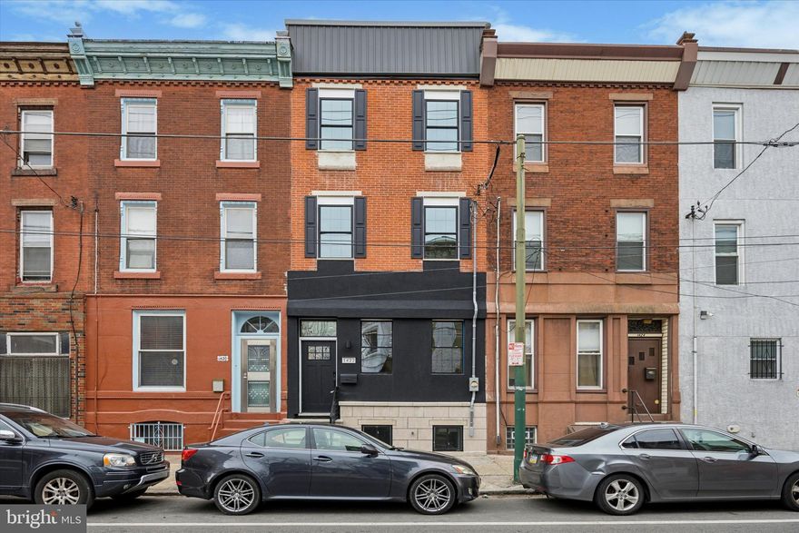 Exquisite Fully Renovated 3-Story Home – 3200 Sq Ft of Luxury Living & Stunning City Views! Offering coveted Tax Abatement and 1 Year Builder Warranty.
Welcome to this breathtaking home that offers luxurious living space, thoughtfully designed for modern comfort and elegance. Every detail has been meticulously crafted, from the open-concept layout to the premium finishes throughout.
The spacious living room features a sleek electric fireplace, creating a warm and inviting atmosphere. The stunning, two-tone kitchen is a chef's dream, complete with quartz countertops, top-of-the-line Samsung appliances, and a spacious wrap-around island that flows effortlessly into your private yard – ideal for both entertaining and everyday living.
The second floor boasts two large bedrooms, each with walk-in closets, and a full, beautifully designed bathroom. The convenience of a laundry area in the hallway makes this level as practical as it is stylish.
Washer and Dryer are included.
Head up to the third floor, where you'll find a private wet bar perfect for entertaining, along with the expansive primary suite. This luxurious retreat includes a custom walk-in closet and a spa-like primary bathroom, offering high-end finishes that make every day feel special. This will truly take your breath away!
The fully finished basement provides additional space with a half bath and a large bonus storage area that can easily be adapted to your needs.
The crowning jewel of this home is the full roof deck with panoramic, 360-degree views of the entire city. Whether you're relaxing or entertaining, the views are nothing short of spectacular.
Throughout the home, you'll appreciate 10-foot ceilings and the rich warmth of white oak flooring. The entire house is wired for surround sound and whole-house audio, ensuring a superior listening experience throughout every room. Convenient USB/USB-C outlets are installed throughout for ease of charging devices. The home also features dual-zone air and heating, offering year-round comfort and control.
With every floor offering something special, this home seamlessly combines style, luxury, and practicality. Whether you're hosting guests or enjoying a quiet night in, this home has it all.
Steps from the vibrant Passyunk Square and all the city has to offer. Note, Front Cement will be replaced.
Don’t miss the opportunity to own this exceptional property. Schedule your private tour today!