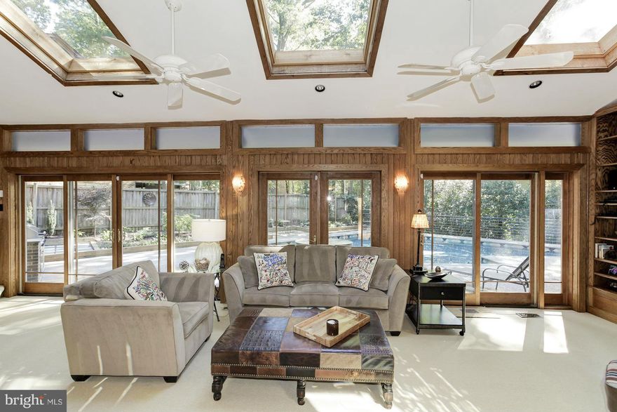 DRAMATIC soaring spaces & light filled rooms! Striking step down LR w/2 story ceilings, 17 skylights, large open DR, award winning table space kit, glass walled family room overlooking gorgeous pool. Impressive 1st floor master suite w/sitting room, FP, door to deck w/hot tub. Lower level features au pair suite or apartment incl. with separate entry,  full kitchen/full bath. Backup offers welcome