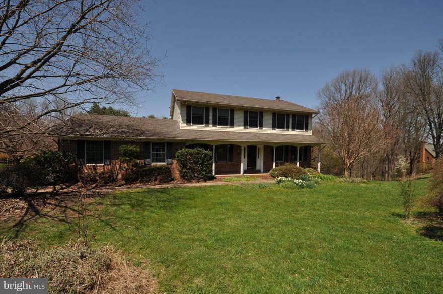 Porch Front Colonial located on non-thru street.  4BD, 3.5BA. Spacious Eat-In Kitchen open to a Family Room with wood burning fireplace and a Sliding door to a huge deck, great for outside entertaining. Separate Dining Room. Hardwood floors on Main level. Finished walkout Lower Level offers spacious recreation room, full bathroom & Office/5th Bedroom. 2 car attached garage with floored attic space.