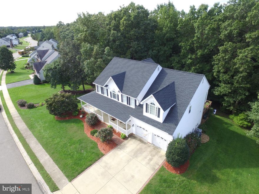 Welcome to this meticulously well-maintained colonial home in highly sought after Kings Grant and La Plata school district. More than 3000 sq ft living space.  Evidence of a continual maintenance program abounds from the elegant gleaming hardwood throughout the first floor, gourmet kitchen (gas stove and granite countertops), the spa like master bath, to the new roof and dual HVAC  (2014/2017). The first floor opens to a formal dining and sitting room which then extends to a gracious open floor plan encompasses the kitchen, sunroom and informal dining area. A guest bedroom and connecting full bath also adorns the main level. Take either the beautiful wood staircase to the second level or the back staircase.  Once there you will not be disappointed! The second floor opens with a beautiful catwalk separating 4 generous bedrooms and a separate laundry room. The master bdrm features two walk-in closets, a separate sitting area and a large bathroom (double vanity, stall shower, jacuzzi tub).  The finished basement offers an additional 1,711 sq feet- make it a mancave (wetbar/refrig, workshop) or a separate living area for the guest who resides in the bedroom/bathroom.  You can access the serene backyard from the basement or the sunroom.  The stone paved patio or deck is ideal for entertaining family. Privacy is not an issue as the mature landscaping / trees abound in the backyard.  Magnificent is the best way to describe this move-in ready home. A quick sale is an option- Home Warranty included.