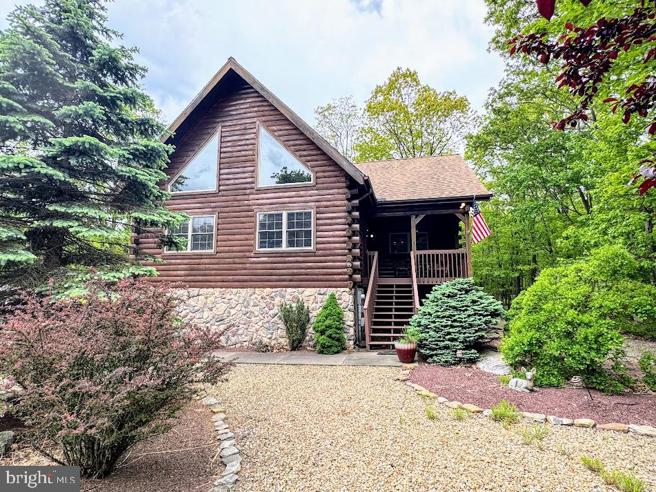 ALL LOG HOME ENTHUSIASTS, THIS QUINTESSENTIAL, COZY LOG HOME IS JUST WHAT YOUR LOOKING FOR ! IT'S THE PERFECT MOUNTAIN RETREAT HOME LOCATED IN THE 4 SEASON , GATED COMMUNITY OF EAGLE ROCK RESORT, NESTLED IN THE BLUE MOUNTAINS OF PA. Located on a corner lot, enjoy the peaceful surrounding nature, from the screened in porch, deck, or your hot tub. This 3 bed, 3 bath home features; open concept living , vaulted beamed ceilings in LR, stone FP in LR, hot tub, screened in porch, granite counters and island in the kitchen and so much more.
Enjoy the 4 season amenities that Eagle Rock has to offer; 2 golf courses, lake with beach, indoor/outdoor pools, tennis, pickleball and basketball courts including a full , indoor basketball court, bocce ball pavillion, gym, spa , equestrian center and so much more!