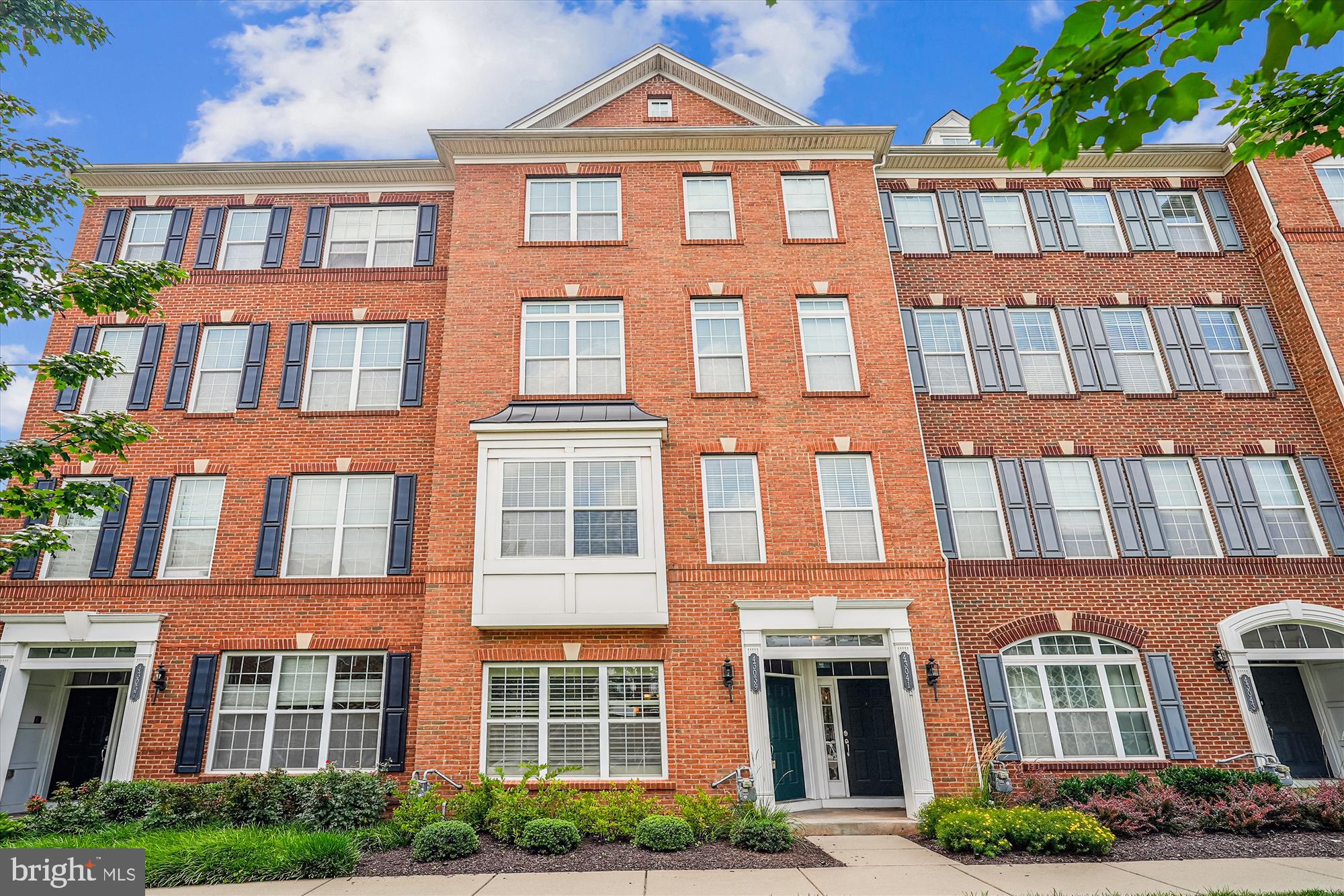 FRESHLY PAINTED AND ALL NEW CARPET ***Live Where Luxury Meets Location***Home exudes comfort, elegance and openness. 1625 Sq Ft of Style & Comfort - in this beautifully maintained 1625 sq ft condo style townhome nestled near Brambleton Park & Ride and the Ashburn Metro station. Hardwood flooring throughout the main level, 9' ceilings, and plantation shutters throughout. The gourmet kitchen features granite countertops, a five-burner stove and trusted Whirlpool appliances and new stainless-steel refrigerator. The spacious master suite offers oversized walk-in closet, deluxe master bathroom with double vanities, large soaking tub and stand-alone shower; stylish tray ceiling with ceiling fan and access to a peaceful covered porch—perfect for unwinding. Residents enjoy top-tier community amenities including a fitness center, outdoor pool, and recreation room. Plus, lawn maintenance is included, so you can spend more time living and less time landscaping.