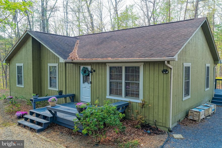 Nestled in the serene community of Bryce Mountain, this charming cottage-style home offers a perfect blend of comfort and modern amenities, making it an ideal investment opportunity. Built in 2002 and recently renovated in 2023, this property boasts a pristine condition that is sure to attract discerning buyers. Step inside to discover a warm and inviting interior featuring three spacious bedrooms and two full bathrooms. The open-concept design seamlessly combines the dining and living areas, enhanced by beautiful wood floors and a cozy gas fireplace, perfect for those chilly evenings. The primary suite includes a luxurious bath, while upgraded countertops throughout add a touch of elegance. Ceiling fans and a well-placed entry-level bedroom ensure comfort and convenience for all. The kitchen is equipped with essential appliances, including a dishwasher, electric oven/range, and refrigerator, making meal preparation a breeze. The main floor laundry adds to the home's practicality, allowing for easy living. Outside, the property shines with its thoughtfully designed exterior features. Enjoy summer barbecues on the deck or relax in the hot tub under the stars. The expansive lot, measuring 0.29 acres, is beautifully landscaped and backs to trees, providing a tranquil retreat. Additional amenities include a BBQ grill, outdoor lighting, and a play area, making it perfect for gatherings or quiet evenings. Security is paramount, with a comprehensive system that includes smoke detectors, exterior cameras, and 24-hour monitoring, ensuring peace of mind for residents and guests alike. From an investment perspective, this property offers significant potential for rental income, especially given its desirable location and modern features. The association provides snow removal and road maintenance, enhancing the appeal for seasonal renters or long-term tenants. The proximity to stunning mountain views and wooded areas adds to the property's allure, making it a sought-after destination for nature lovers and outdoor enthusiasts. With its combination of comfort, modern amenities, and investment potential, this home in Bryce Mountain is not just a property; it's a place to create lasting memories. Don't miss the chance to make this inviting retreat your own or add it to your investment portfolio!