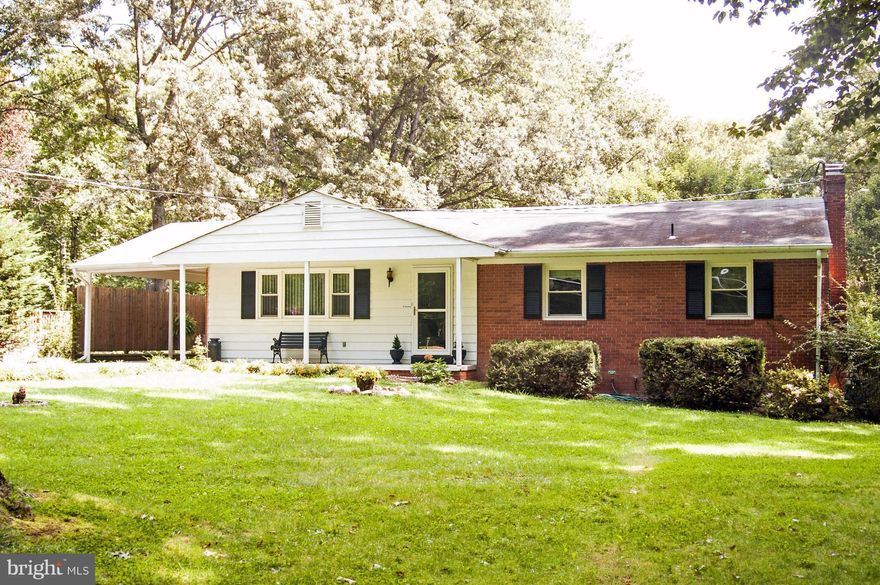 Peaceful setting. Enjoy Wildlife in your back yard from porch or covered sitting area. 4 bed/3bath  .5 acre w. addtl .48 ac back yd easement. In law suite. Fully fin walk out basement. replaced windows. Public water and add/ well for watering plantings. Carport. Spacious Rec rm w wood burning stove-2 cords wood. Wood Fls. Sep. Dining/Family rm. 2 sheds. Generator conveys.  Front sitting porch.