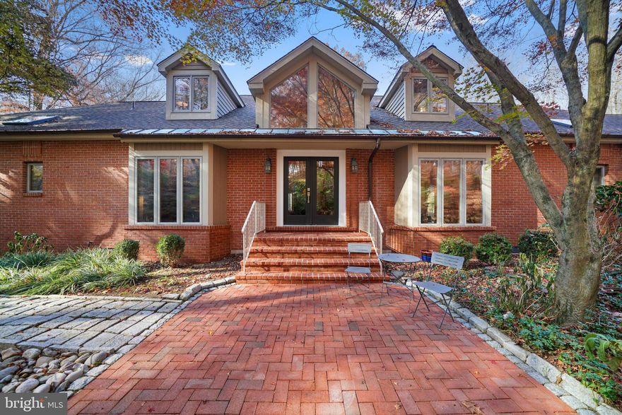 Come discover this remarkable one-of-a-kind 4 bedroom, 3.5 bath custom built home at 40 Dilworthtown Rd. nestled on 4 acres in the highly sought-after Thornbury Township renowned for its low taxes and situated in the Rustin High School District. This home features an open floor plan, coveted first floor primary bedroom, large screened-in porch, walk-out basement and in-ground heated salt water swimming pool.  As you approach, be greeted by cobblestone and brick walkways leading to the double door entry, inviting you into a large two-story foyer. From here, enjoy front-to-back views of the stunning wooded lot that surrounds this remarkable property. The open floor plan is designed with entertaining in mind, featuring a spacious great room adorned with random-width hardwood flooring, multiple cozy seating areas, and a striking slate gas fireplace with soapstone hearth.  Double large sliding doors lead to the large screened-in porch, complete with ceiling fans, providing a perfect vantage point to overlook the in-ground heated saltwater swimming pool and hot tub with waterfall. The heart of this home lies in the sun-filled kitchen, a chef's delight with high ceilings, dramatic pendant lighting, and an atrium with a seating area that creates a bright family room space. Recent updates include quartz counters, a stainless farm sink, double ovens, dishwasher, and an induction cooktop. A sub-zero refrigerator , large pantry and radiant heated floors add to the luxurious appeal. The first floor hosts a coveted primary bedroom with high ceilings, large windows with a built-in window seat, and a private balcony offering a peaceful escape with views of the wooded scenery and has convenient access to the pool. The spa-like primary bath boasts radiant heated floors, a large soaking tub, steam shower, and a heated towel rack. A large walk in closet completes the primary suite.  Additional features include a large dining room with wood wainscoting, a home office with floor-to-ceiling built-ins, pocket doors and a bay window. A spacious mudroom with access to the oversized two-car garage with large storage closet and powder room adds convenience to daily life. The second floor encompasses three generous bedrooms with hardwood floors, ample closet space, cedar closet, and a newly renovated hall bath with a zero-entry tile shower, tile floor, double sinks, and a custom storage cabinet. The finished walkout lower-level transforms into an entertainment haven, featuring a TV/game room area, a home gym space, ample storage space and a full bath.  Sliding doors open to a covered patio and a pathway leading to the in-ground pool, seamlessly blending indoor and outdoor living experiences.  The grounds are landscaped with terraces and hundreds of specimen shrubs and trees protected with deer fencing. There is also a generator. The views from this amazing property are truly spectacular.  This prime location is conveniently located near shops and restaurants in Glen Mills, West Chester Boro, Media, and the new Wawa train station. This one-of-a-kind home offers an easy commute to Philadelphia, and Wilmington making it the perfect place to call home. Don't miss this rare opportunity to experience this exceptional property.  Arrange your private tour today.