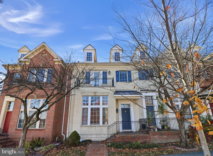 Exceptional! One of the largest model with 3.5 bath! High-end upgrades with solid hardwood flooring throughout. Large open KIT w/granite countertop & stainless appliances.  Dramatic double story living room. Separate Dining area. Master bedroom with 2 large walk-in closets, separate shower & soaking tub! High ceiling basement with a full bath. Spectacular views overlooking a park and enjoy the July 4th Firework right from the front windows!  Take a stroll through the park to the playgrounds and many sport counts. Amazing community amenities including  free shuttle to the Metro, two outdoor swimming pools, club house, fitness center, tennis court and much more.  Walk to Starbucks, grocery, banks, restaurants and shops!  Don't miss! Owners require good credit and sorry, absolutely no pet.