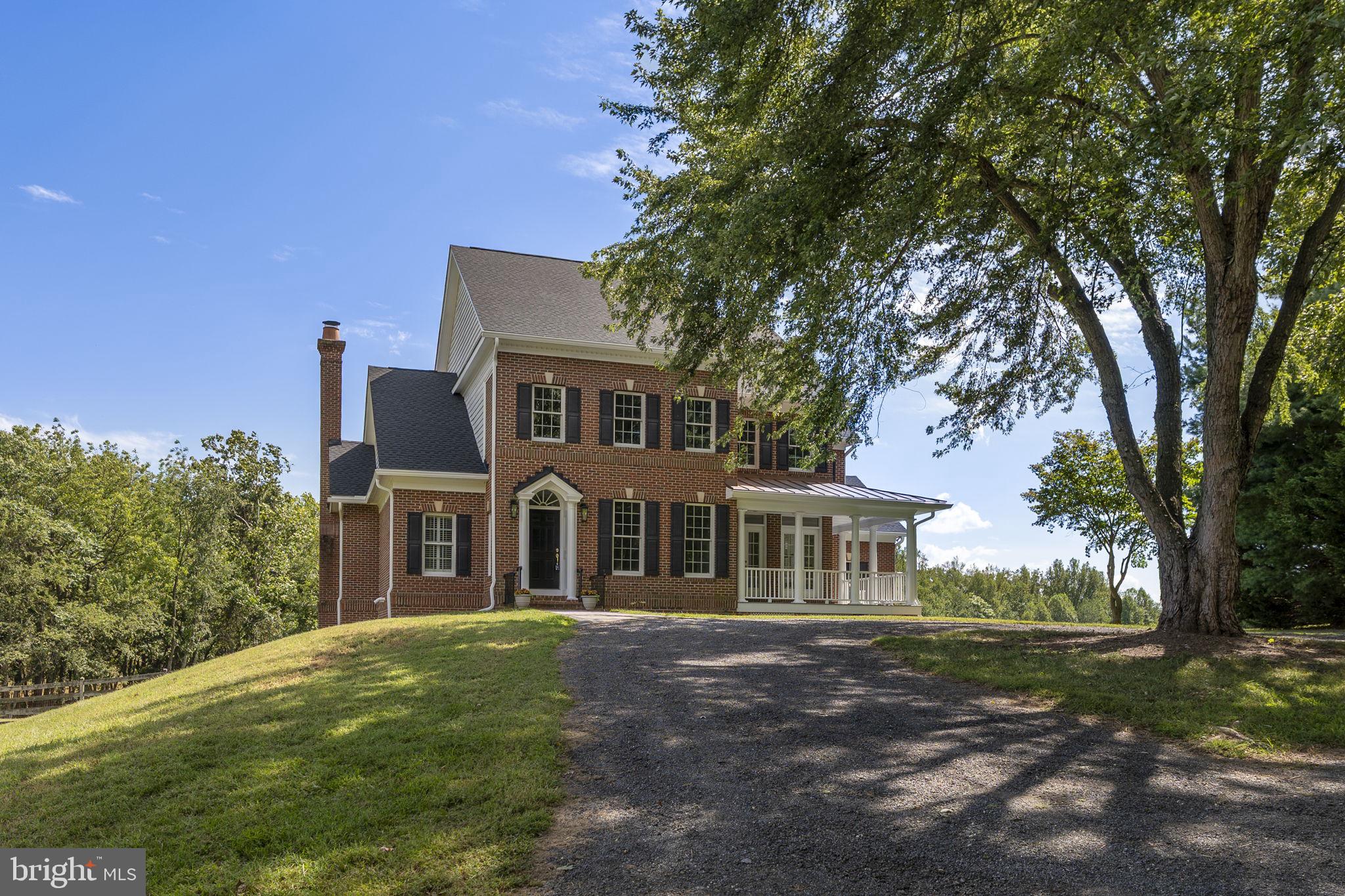 Welcome to your own private paradise in Boyds, a custom-built home perfectly situated on 8 acres of serene, wooded beauty. Travel down the long scenic driveway to a circular approach that leads you to the front door of this one-of-a-kind retreat.
Designed for entertaining, the heart of the home is the gourmet kitchen, featuring a top-of-the-line 6-burner Viking range, a full-size fridge and freezer, dual dishwashers, a huge pantry, brand new quartz countertops, and a large center island. A sun-filled breakfast nook provides the perfect spot for casual meals, while the adjacent grand family room impresses with vaulted ceilings and a charming brick fireplace. The main level also offers a formal dining room, a spacious living room, and a private office....along with fresh paint and new carpet throughout the upper level.
Upstairs, the primary suite is a true retreat, complete with a private balcony overlooking the lush greenery, a walk-in closet, and an ensuite bath featuring a double vanity, soaking tub with a view, and stall shower. Three additional bedrooms and two full baths complete the upper level—one with its own ensuite and the other two sharing a Jack-and-Jill bath, ideal for family or guests.
The walkout lower level offers fantastic unfinished space ready for your vision, with easy access to the backyard and the attached 3-car garage.
Enjoy the peace and privacy of this spectacular setting while still being conveniently located near commuter routes, parks, and shopping. This is more than a home—it’s a lifestyle.