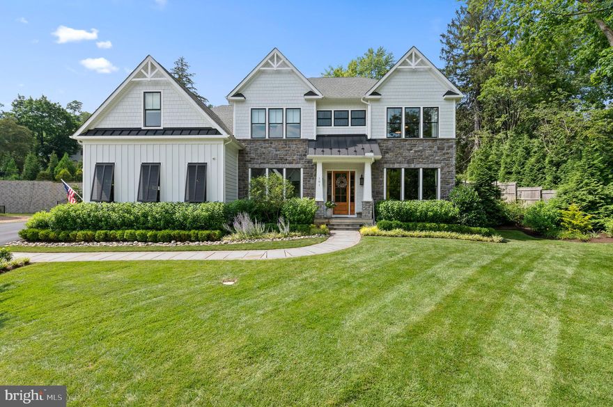 Crafted by the esteemed Rockwell Custom, this exceptional home is nestled within a cul-de-sac community of 13 residences.  Incorporating exquisite design, functional spaces and nearly every upgrade available, it's a testament to quality construction and attention to detail, promising an epitome of luxury living.  The Roosevelt design exemplifies a perfect blend of elegance and practicality, making it ideal for both social gatherings and relaxed living.

Stepping into the two-story foyer, you're welcomed by the warm, inviting living room. A spacious home office, complete with built-in cabinetry, is an ideal environment for work or study, paired with a strategically positioned powder room for guests.  A dining room is a ideal space for dinner parties, served by a convenient wet bar and fridge. The dining room transitions seamlessly into a gourmet kitchen, finished with sleek quartz countertops, white cabinetry and top-quality appliances, including a La Cornue range, a Subzero fridge, and a Bosch dishwasher.  The breakfast room offers a comfortable atmosphere for casual dining. A gas fireplace in the adjacent family room, along with double French doors leading to the rear patio, blends indoor and outdoor living. An additional French door in the kitchen enhances outdoor accessibility.

The home's emphasis on convenience and functionality is demonstrated by a walk-in pantry, furnished with a second oven and refrigerator drawers. 

Next to the kitchen, a mudroom, featuring a herringbone floor, built-in workstation, shelving, and tasteful wainscoting, leads to the two-car attached garage. Hardwood flooring throughout the main level imbue the home with elegance and refinement.

On the second floor, another home office space is graced with a wall of bookshelves. The primary bedroom, complimented with ceiling beams and elegant built-ins, leads to a luxurious full bath with a tub, a walk-in shower, and a double sink vanity. 

The home includes an ensuite bedroom with abundant closet space and two additional bedrooms connected by a Jack and Jill bath. An upstairs laundry room, complete with a barn door entry, washer, dryer, and unique tile flooring, offers ample folding space. A secondary staircase adds convenience and architectural intrigue.

The walkout lower level is a haven for relaxation and entertainment. The den, with its brick accent wall and linear fireplace, exudes charm. A full wet bar, an exercise room with a rubber floor and mirrored wall, and a wine room enhance the living experience.

Additional noteworthy features include millwork and moldings in many rooms, Bermuda shutters in the study and kitchen, lighted glass display cabinets in the kitchen, a professionally landscaped exterior with a paver terrace and espalier apple trees, decorative ceiling treatment in the foyer and a tech-friendly Sonos & Lutron system. The home also includes an irrigation system with drip lines and a Belgian block driveway apron.

The peaceful location makes it easy to forget how convenient close you are to award-winning schools, dining, shopping and all major transportation routes.