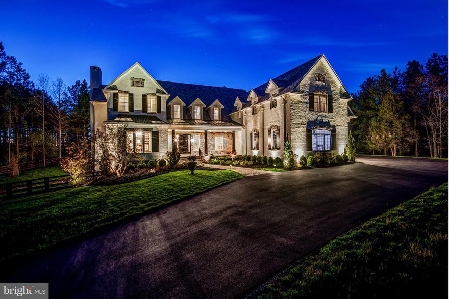 Welcome to this stunning French-Farmhouse style masterpiece built by luxury home builder, Apex Custom Homes, and sited on 3+ pine-tree lined, private acres behind the gates of the award winning, private Creighton Farms Country Club community. This spectacular all stone and brick home is effortlessly timeless and a true one-of-a-kind masterpiece boasting high end and designer touches and finishes throughout to include  an oversized three-bay three-car garage; hand scraped hardwood and marble flooring; brand new carpet in Bedrooms; fresh paint throughout; open floor plan in the heart of the home that features an Entertainer's dream Kitchen and Breakfast Room with Habersham custom cabinetry and commercial grade appliances perfectly suited for home Chefs of every skill level, which flows seamlessly into the Family Room with its cozy gas fireplace ; a Butlers Pantry the can be accessed from the Kitchen and Formal Dining Room; main level Home Office; lavish Owner's Suite with Sitting Area gives way to an unbelievable Owner's walk-in closet and dressing area that boasts both elegance and elevated functionality; luxurious Owner's Bath with an oversized soaking tub, walk-in shower and dual vanities; two additional Bedrooms on the upper level, each serviced by their own private Bath; upper level Laundry and Sorting Room; a walk-out lower level hosts an expansive Game/Club Room with wet-bar, private stone Wine Tasting Room, Recreation Room, Home Theatre Room, guest Powder Room and a Guest Bedroom with En-Suite full Bath; a four-level elevator (stops on all three levels plus the garage). Extend your living and entertaining spaces to the outdoors with your custom, heated pool with waterfall and hot tub, flagstone patio and wall-seating, and a finished Pool House with wet-bar and beverage fridge and full Bath. Creighton Farms is one of greater Washington DC’s most extraordinary, exclusive private club communities. The crown jewel at Creighton Farms is the 18-hole Jack Nicklaus championship golf course. Unparalleled resort style amenities include a brand-new state of the art golf facility with heated indoor bays, two Har-Tru & two USTA hard-surface tennis courts, fitness & wellness facilities, a resort style pool and an elegant Club House offering indoor & al-fresco dining, overnight club rooms for members and guests, Board Room, Library, Golf Shop & more.