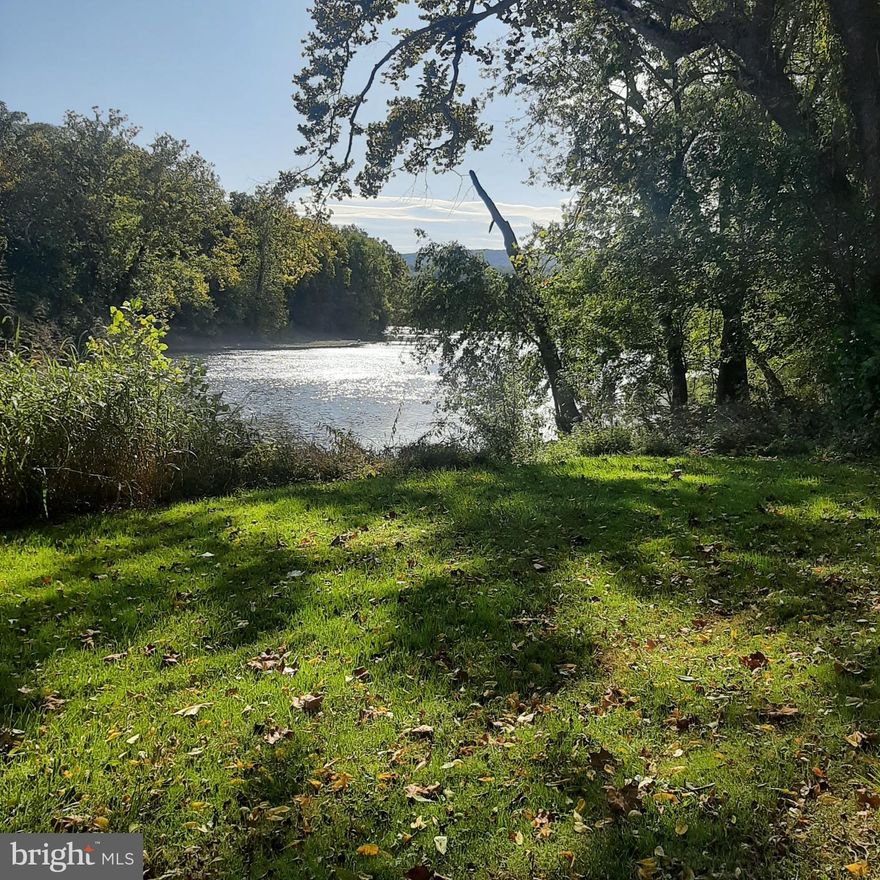 A truly lovely property! Private, idyllic, 475 feet of Shenandoah Riverfront.  Easy river access to swim, tube, canoe or fish. Views of the river and river bend from all front interior windows, the front deck and screened in porch and upper bedrooms.  Large Area fenced front yard. Spacious main living room is 24 x 15 with woodstove open to kitchen, hallway & half bath. Back door to rear porch. Upstairs is four rooms with full bath.  New Metal Roof/Chimney re-lined in 2013.