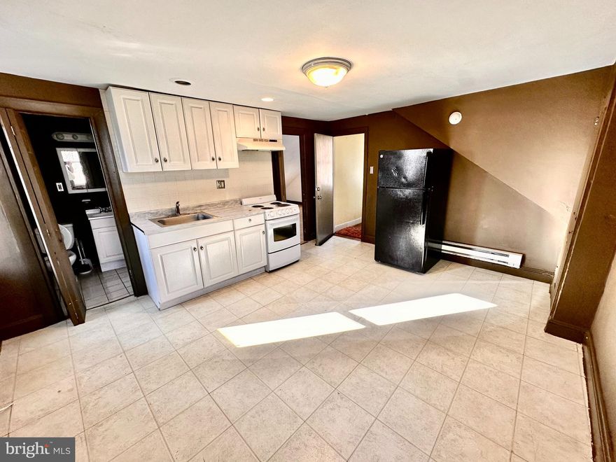 Third floor 1 bedroom Germantown apartment available for quick move in. The bedroom is large with good closet space. Parquet wood floors in bedroom. Galley kitchen with electric range and refrigerator. 3 piece bath with shower tub. Shared laundry on side of building. Plenty of shared outdoor space also. Located on a nice block in West Germantown with mature trees and is very walkable to public transportation and local shops. Reach out for the video tour or for showings and applications. Good credit and verifiable income required. Cat friendly. Tenant just pays electric.