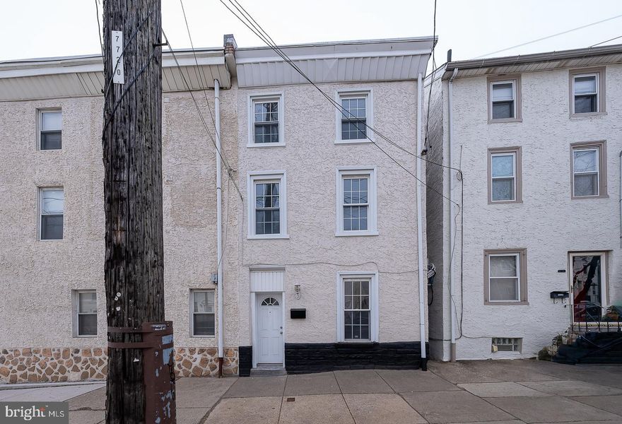 Nestled in the vibrant heart of Manayunk, this twin home blends traditional charm with modern updates.   Originally built in 1900 and renovated in 2006, refreshed in 2025.  The well-designed layout encompasses 1,380 square feet living space, featuring four bedrooms and two full bathrooms.  Wood flooring flows throughout the main living areas, while new plush carpeting in the bedrooms adds a touch of warmth and comfort. A spacious kitchen, equipped with stainless steel appliances including a built-in microwave, gas oven/range, dishwasher, and refrigerator. The convenience of full size washer and a gas dryer enhances the functionality of this exquisite residence. The outdoor space features a level rear yard that offers a private space for outdoor gatherings or quiet moments, al fresco dining or simply enjoying the fresh air in this urban retreat. Located in a thriving urban environment, this property offers easy access to dining, shopping, and entertainment options, as well as public transportation, making it a perfect choice for those seeking a vibrant lifestyle. The unassigned parking lot nearby ensures that you and your guests will always have a convenient place to park. Experience the best of Manayunk living in a property that has been lovingly updated while retaining its historic charm.