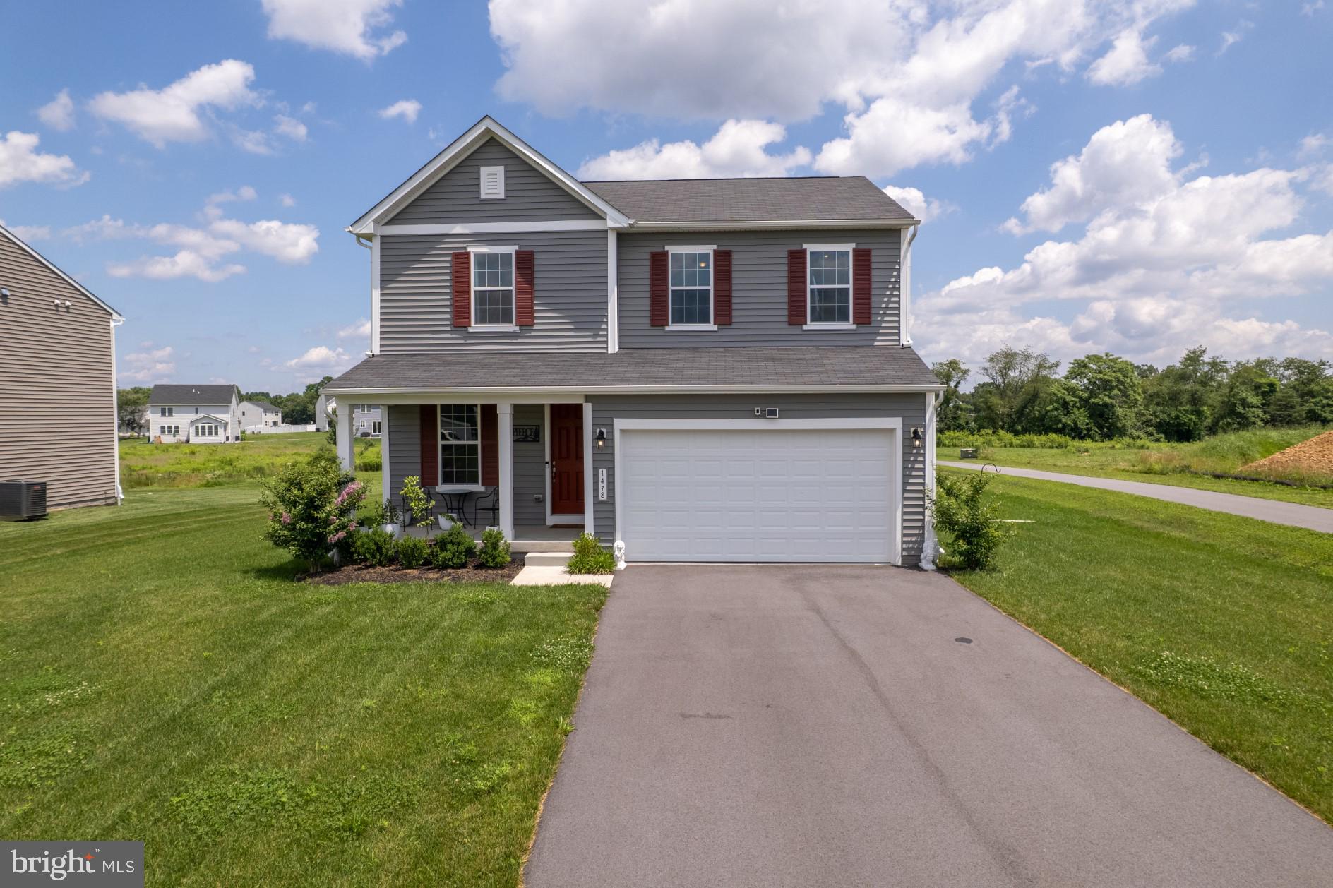 Welcome Home to Warm Spring Ridge where you’ll find this almost brand new home! If new construction is on your radar, but you need something quicker and more affordable, this home is your answer. As soon as you travel through the neighborhood, you'll find the well-maintained community you've been looking for. Step on to the front porch and enter in to a sitting room that can also be used as an office space or even an additional dining area. Immediately, you’ll see through to the open floor plan across the rear of the home to include a living room with fireplace, dining area, and kitchen with large island and the most gorgeous backsplash. Also, the pantry here is a dream! One of the main floor highlights is the double sliding glass doors that lead to the covered back porch big enough for all your outdoor gatherings and grilling desires! Upstairs, it's likely that the large primary suite will be your favorite. This large space was designed with a double vanity, gorgeous tiled shower, separate toilet room, and the walk-in closet you've been wanting! Just outside the primary suite is a large laundry room with sink. The open living area upstairs is currently home to a lounging/TV and home office space, but can have many purposes based on your needs! You could even easily close it in if a 4th bedroom on your wish list. The remainder of the second floor hosts two additional bedrooms and a full bath. In the basement, high ceilings and open space are awaiting your finishing touches. Additional bedrooms, living spaces, and even a bathroom are ready to be complete with your customization! Don’t miss your opportunity to own this home that is completely move-in ready and barely lived-in. Call today for your private tour!