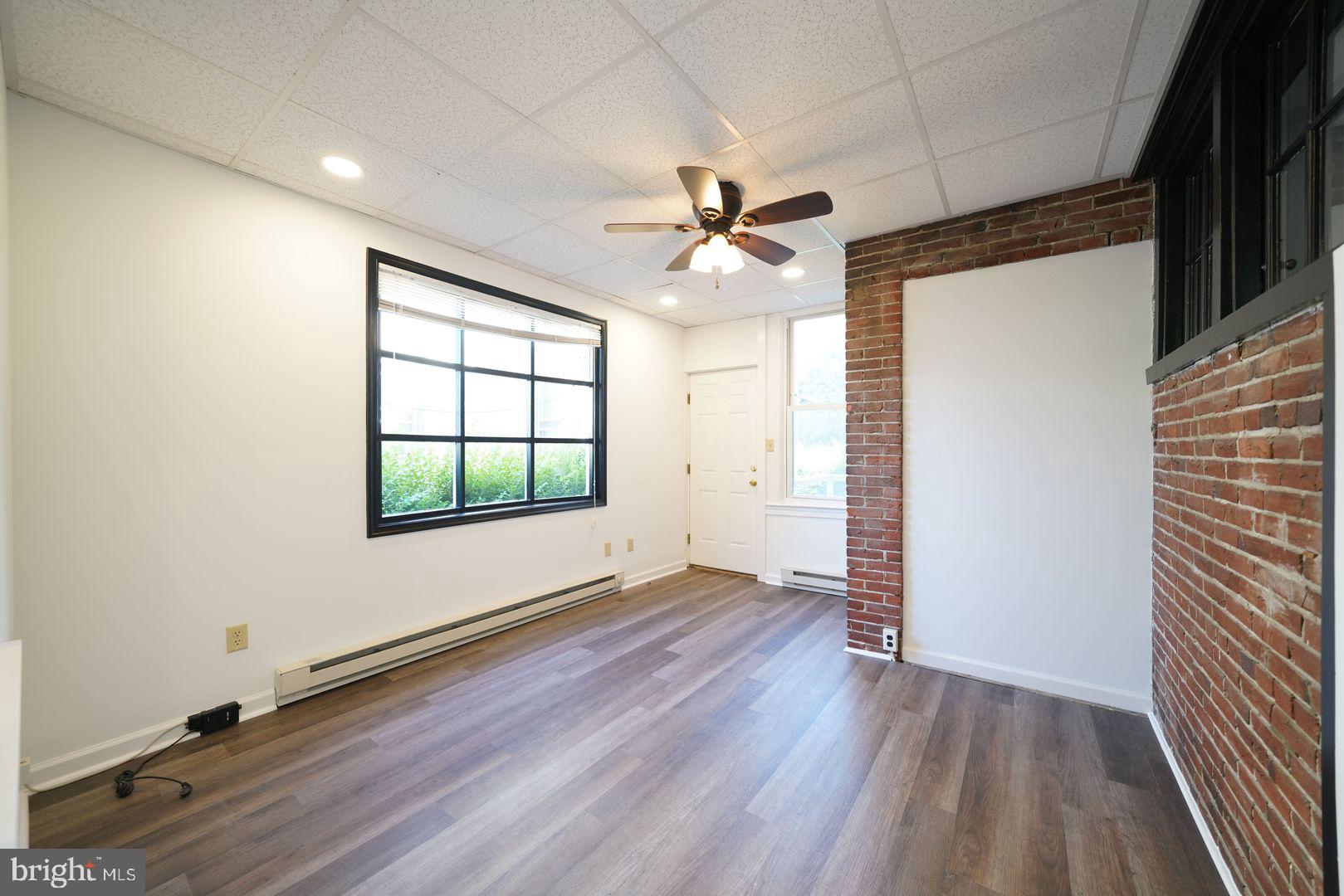 Charming 1 Bedroom Apartment in Historic Downtown West Chester
Live in the heart of West Chester in this beautifully updated 1st-floor 1 bed, 1 bath apartment. Featuring gas cooking, stylish LVP flooring, a striking exposed brick accent wall, and both private front and rear entrances, this unit blends character with convenience. Enjoy the ease of private parking—a rare find downtown! Located in a historic building just steps from shops, restaurants, and entertainment.
Not a student rental. Coin Operated Washer & Dryer in shared basement of building.
Lawn & snow are included in rent. Trash fee $25/month. Pets welcome - $50/month + $600 non refundable pet fee. Minimum Credit score of 690 and income of 3x monthly rent required.