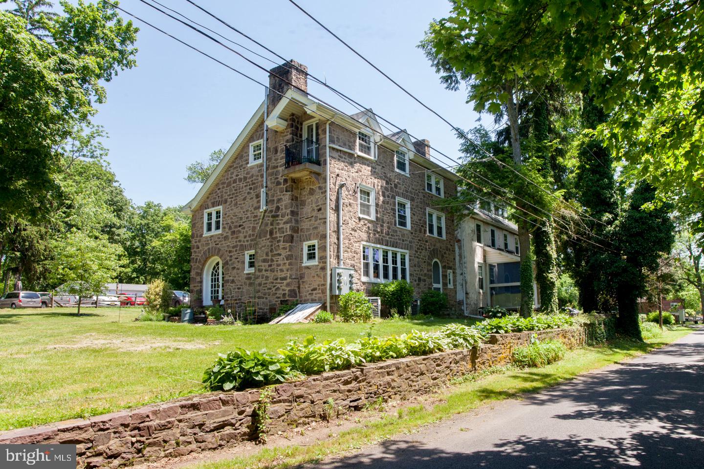INVESTORS! A rare opportunity for a great investment in the very desirable Buckingham Township. This stone building was the original site of the Montessori Childrens Village and it has been converted into a 13 residential rental unit apartment building. There are a total of 13 units one being a detached cottage - (9 are one bedroom apartments and 4 are two bedroom apartments). Each apartment is unique and somewhat eclectic with many of the tenants having been here long term low turnover. One of the units is in the midst of being totally remodeled and is ready for you to finish. Located in a very picturesque area of Bucks County and yet very convenient to all amenities. Exceptionally well maintained with newer individual heat pumps for each unit, newer windows and a high end water management facility supplying the entire building. Ample parking for all of the tenants.