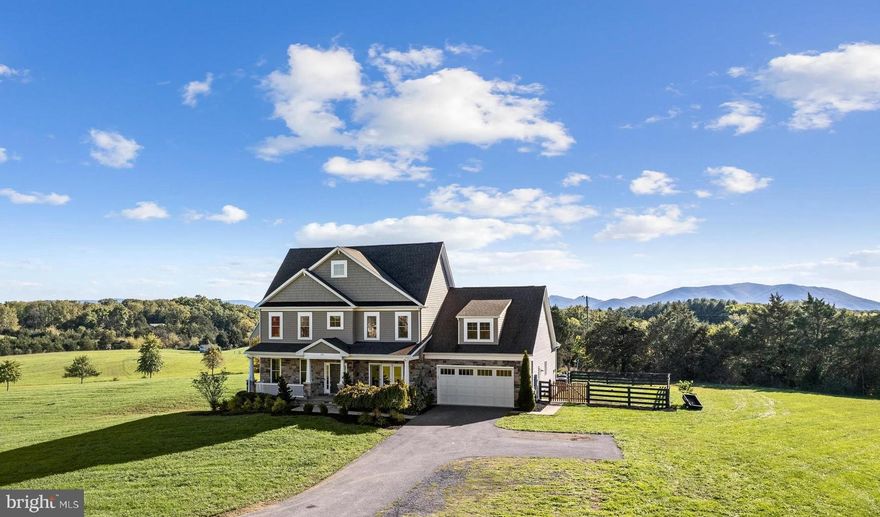 New Price! Welcome to your dream home! This stunning, custom-built Colonial is on a sprawling 5-acre lot in the peaceful Kendall Mills Subdivision. With over 5,100 square feet of beautifully finished living space, it offers the perfect blend of privacy and luxury. Enjoy the serene wooded views and breathtaking mountain vistas from your private oasis. You'll love the spacious and thoughtfully designed layout of 5 bedrooms and 3.5 bathrooms, including a main level primary bedroom with an ensuite bath for added convenience. The gourmet kitchen is a home chef's dream, complete with a kitchen island, breakfast area, and a butler's pantry for extra storage. The open family room with a cozy fireplace is the perfect spot to relax and unwind. And don't forget the bright and inviting sunroom, ideal for entertaining or enjoying quiet time.  Host in style with formal living and dining rooms that are perfect for special occasions. The fully finished basement includes a complete in-law suite with kitchenette, living area, bedroom, and full bath, providing additional living space or guest accommodations. Outdoor features include a charming covered front porch, deck, patio and a spacious two-car garage. Located on well-maintained state roads with no HOA and Verizon FIOS availability, this home offers the perfect blend of rural tranquility and modern convenience. Don’t miss the chance to make the picturesque Kendall Mills Subdivision your new home. All sizes are approximate.